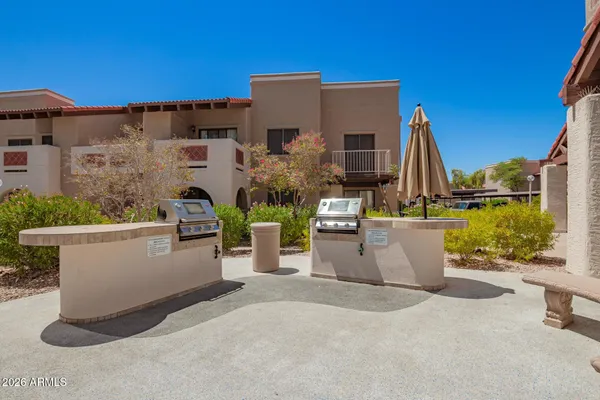 a view of a patio with couches and potted plants