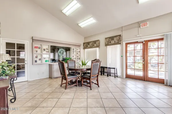 a dining room with furniture and window