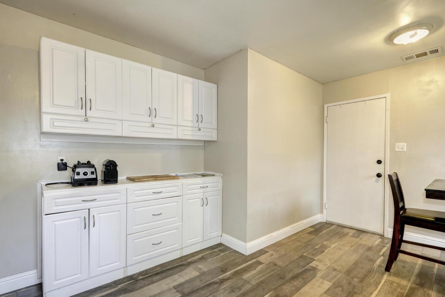 520-522 Oeste Drive Davis, CA 95616 - Photo 17 of 54 a kitchen with white cabinets and sink