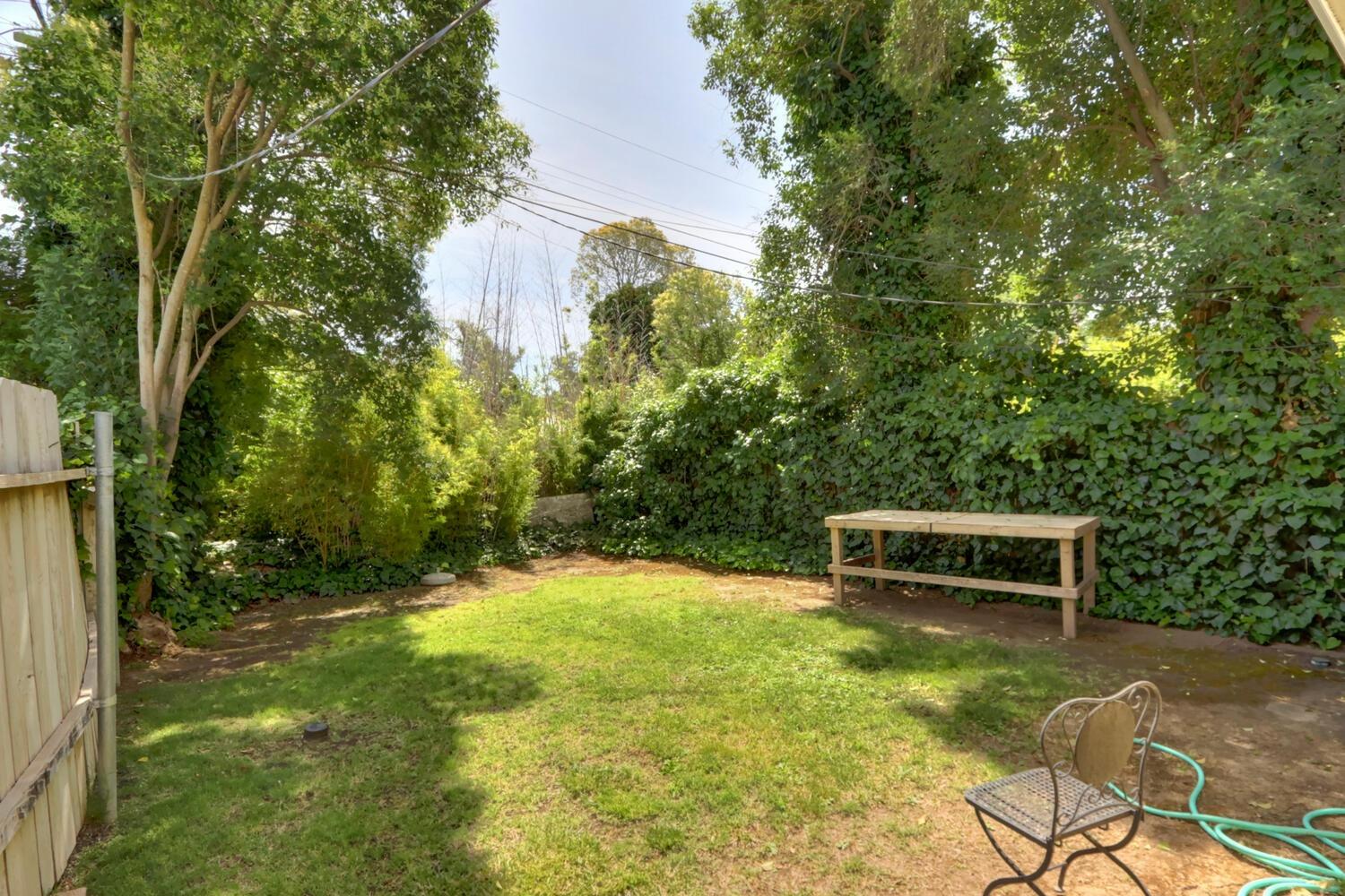 520-522 Oeste Drive Davis, CA 95616 - Photo 22 of 54 a backyard of a house with yard and outdoor seating
