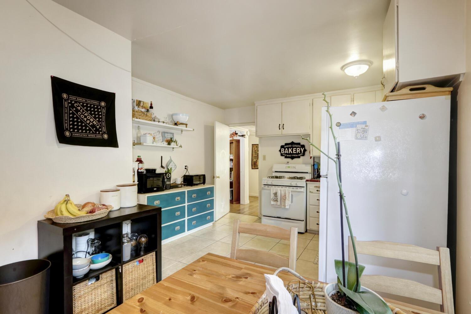 520-522 Oeste Drive Davis, CA 95616 - Photo 39 of 54 a kitchen with stainless steel appliances kitchen island granite countertop a refrigerator and a stove top oven