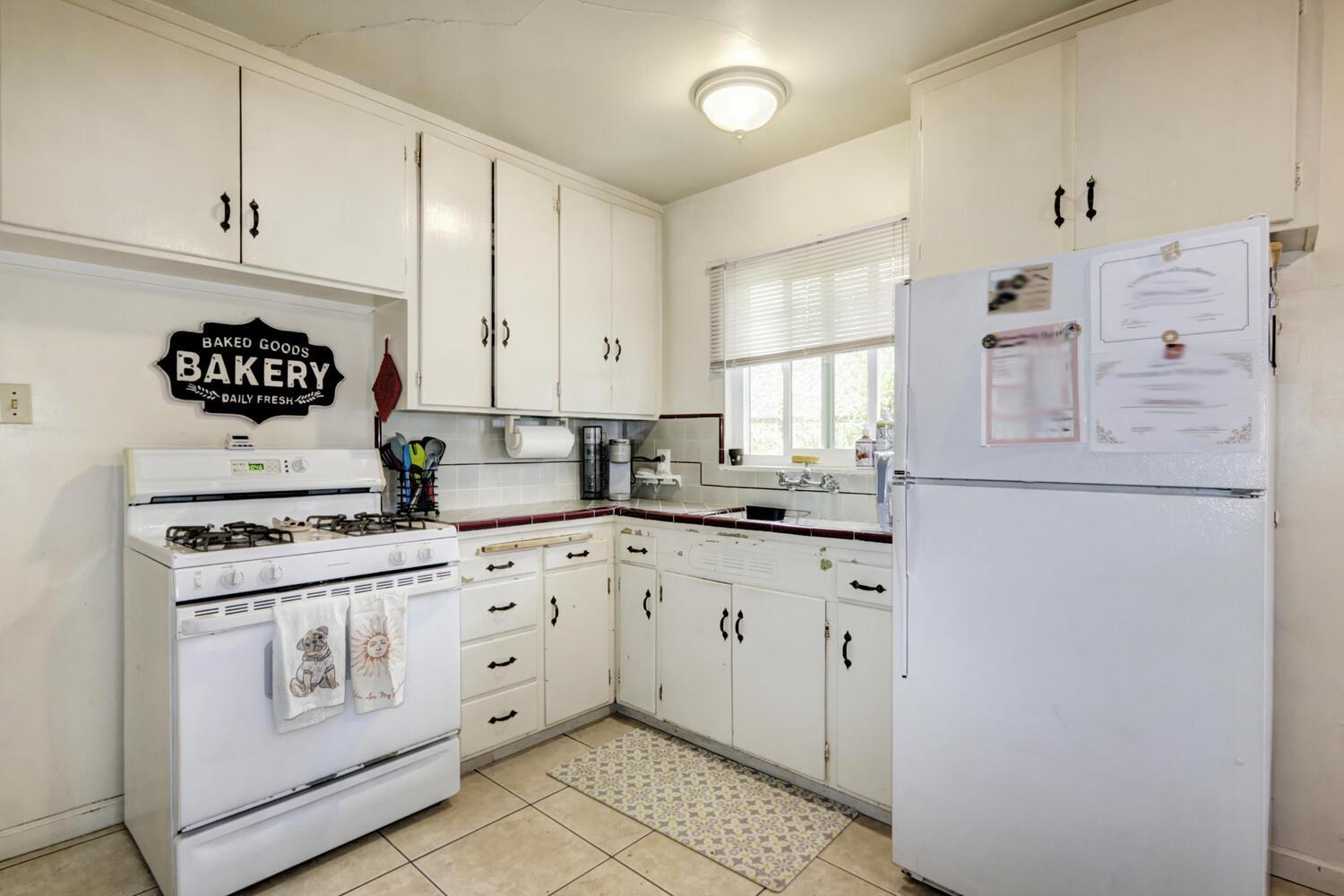 520-522 Oeste Drive Davis, CA 95616 - Photo 43 of 54 a kitchen with granite countertop white cabinets and white appliances