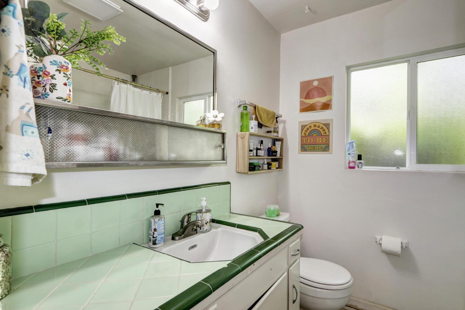 520-522 Oeste Drive Davis, CA 95616 - Photo 47 of 54 a bathroom with a toilet sink and mirror