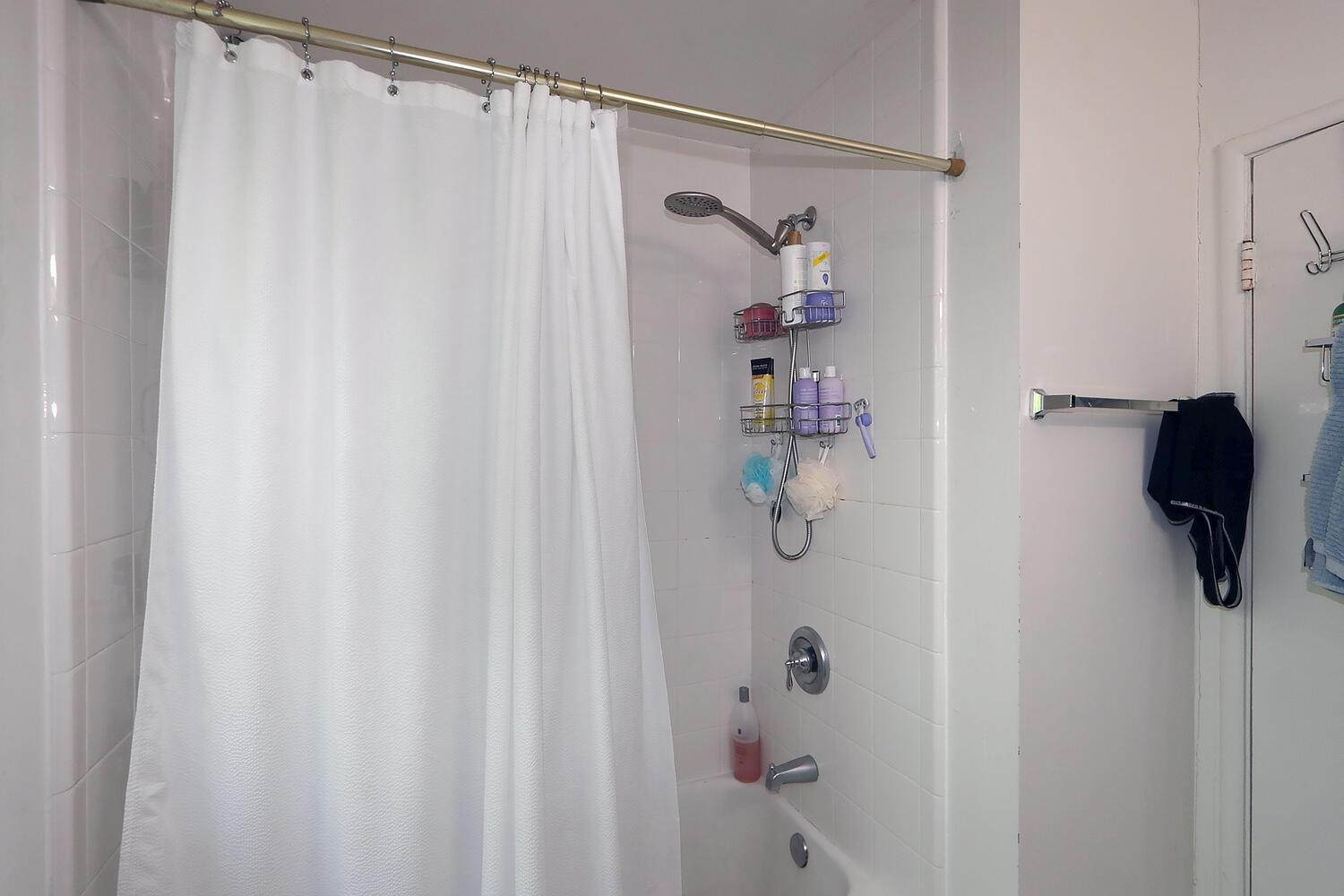 520-522 Oeste Drive Davis, CA 95616 - Photo 48 of 54 a bathroom with a shower and a shower curtain