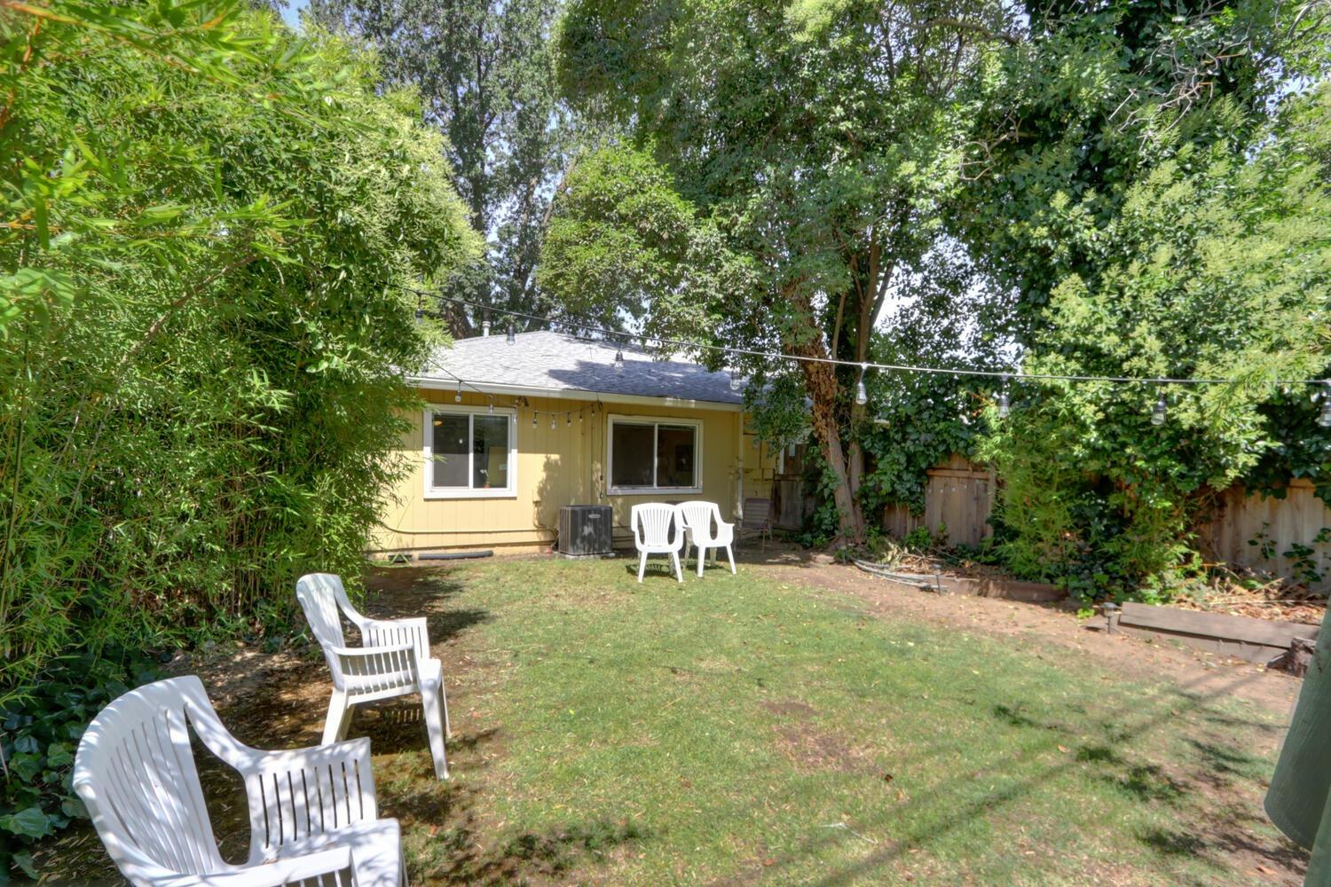 520-522 Oeste Drive Davis, CA 95616 - Photo 53 of 54 a front view of a house with a yard glass top table and chairs