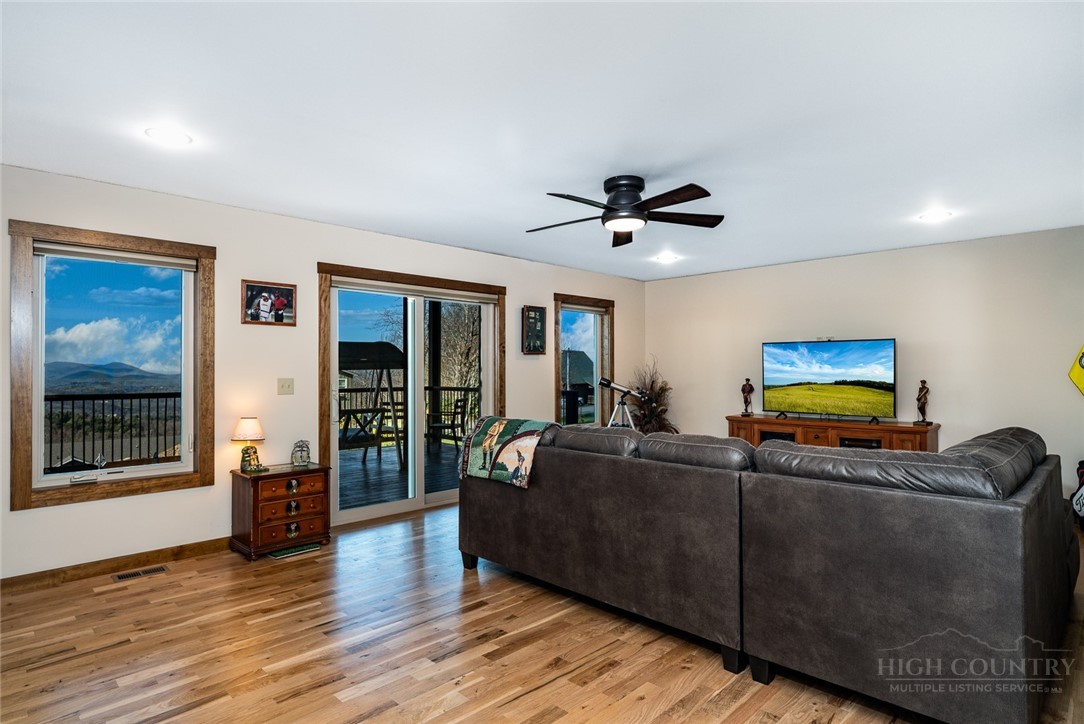 1161 Grandview Dr Extension Boone, NC 28607 - Photo 21 of 43 a living room with furniture and a flat screen tv with wooden floor