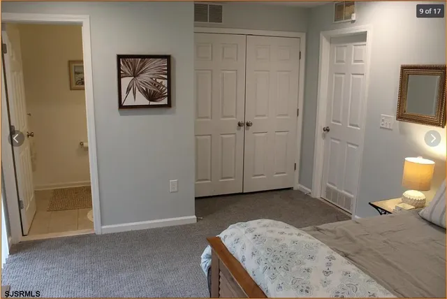 a bedroom with a bed and dresser