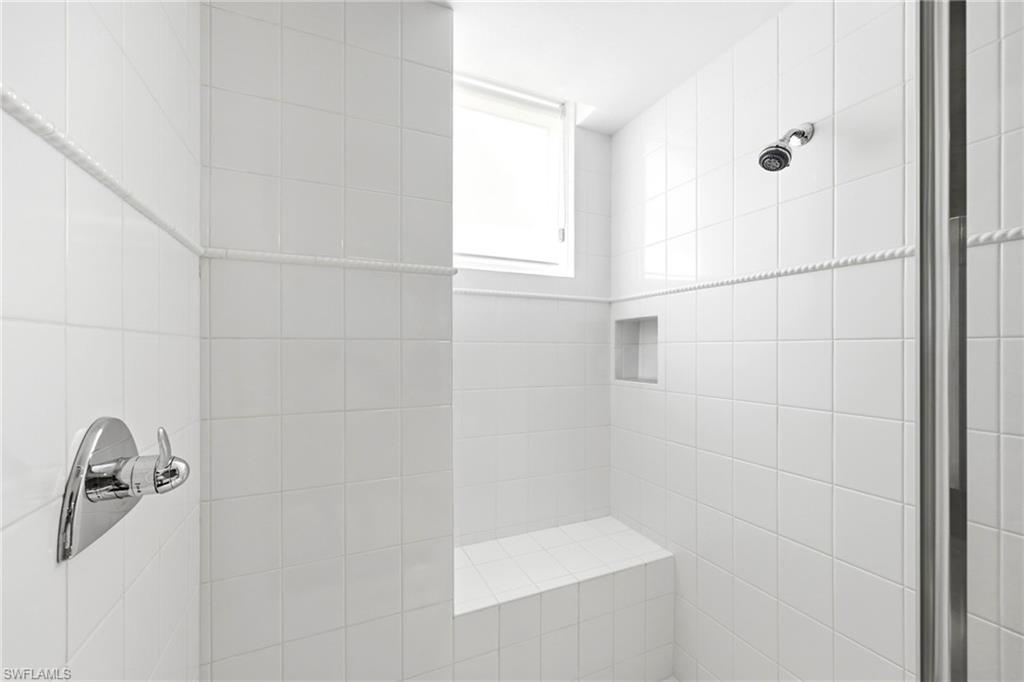 265 Indies Way, Unit 701 Naples, FL 34110 - Photo 32 of 50 a bathroom with a shower