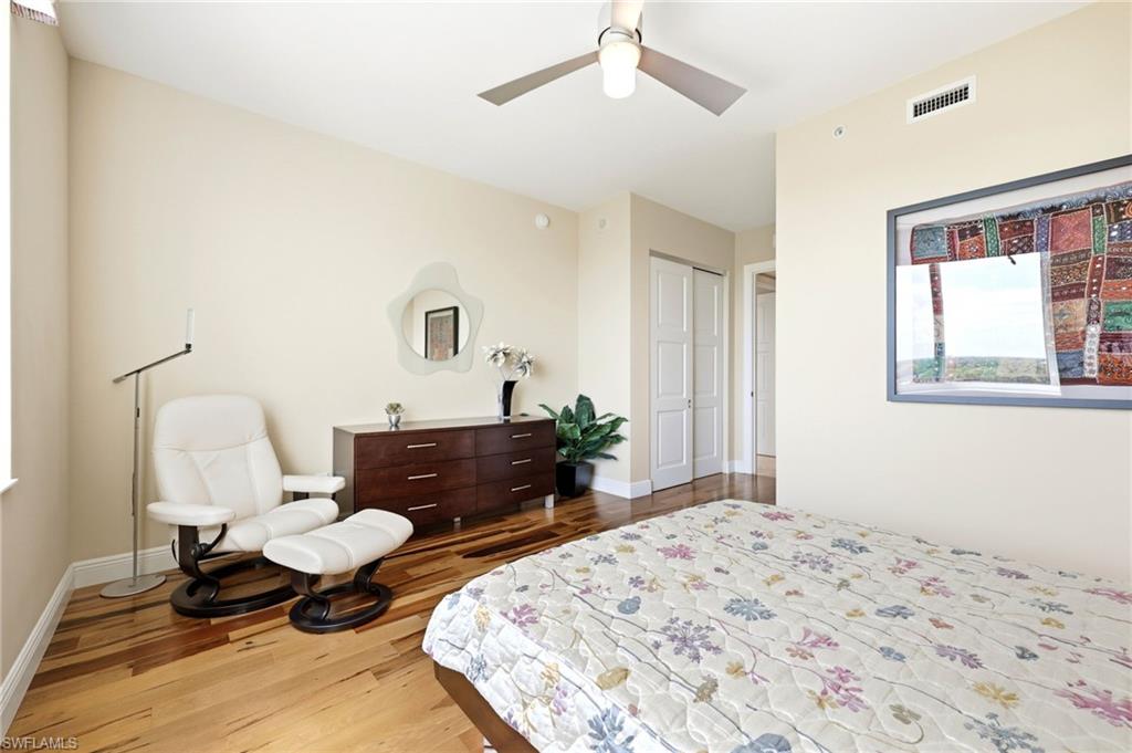 265 Indies Way, Unit 701 Naples, FL 34110 - Photo 35 of 50 a bedroom with furniture and a window