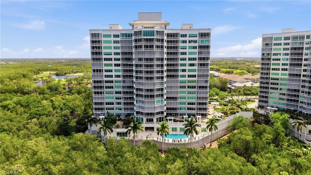 265 Indies Way, Unit 701 Naples, FL 34110 - Photo 46 of 50 a building view with a garden space