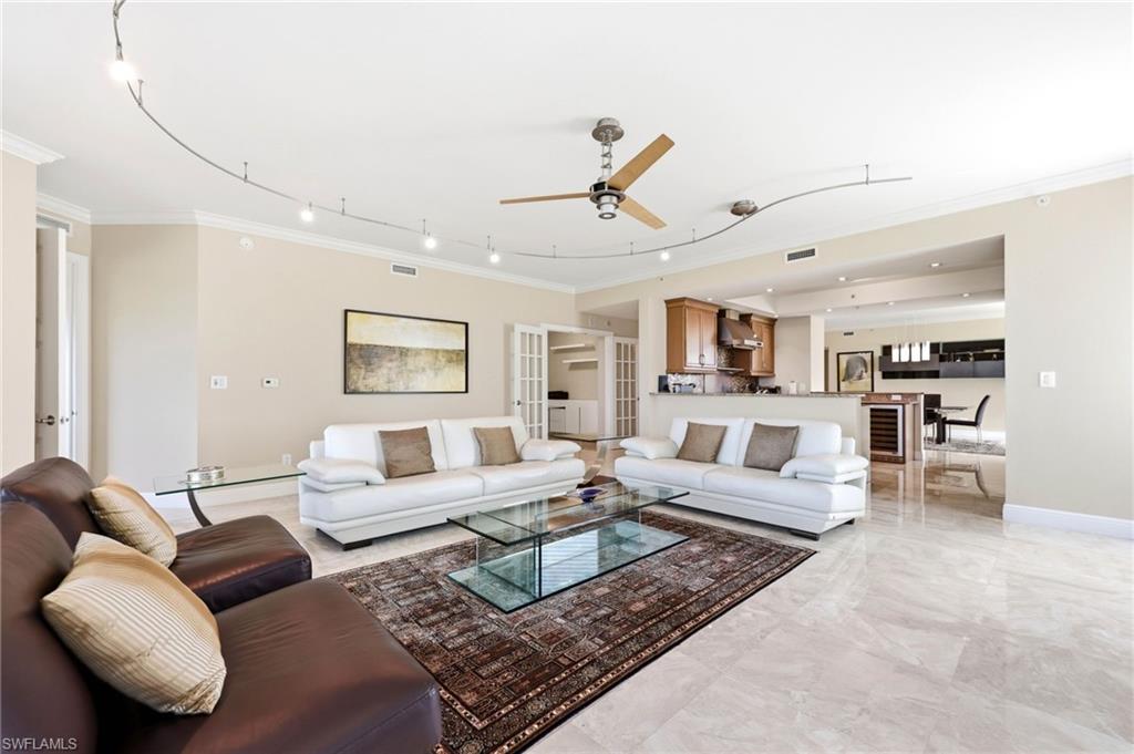 265 Indies Way, Unit 701 Naples, FL 34110 - Photo 9 of 50 a living room with furniture