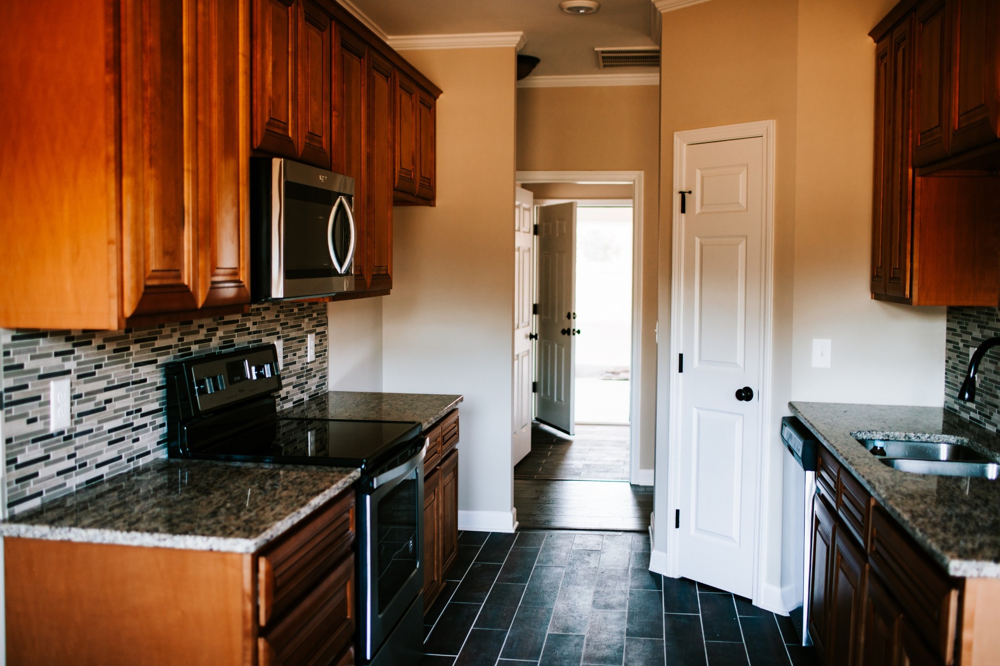 119 Dickson Marks Road Pulaski, TN 38478 - Photo 6 of 15 a kitchen with stainless steel appliances granite countertop a stove a sink and a refrigerator