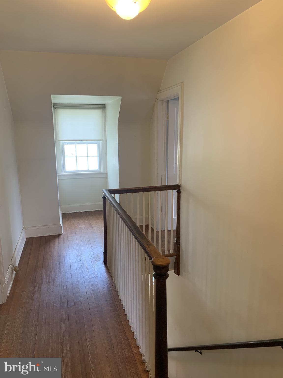 150 Lincoln Road Westminster, MD 21157 - Photo 13 of 39 a view of a hallway with wooden floor and staircase