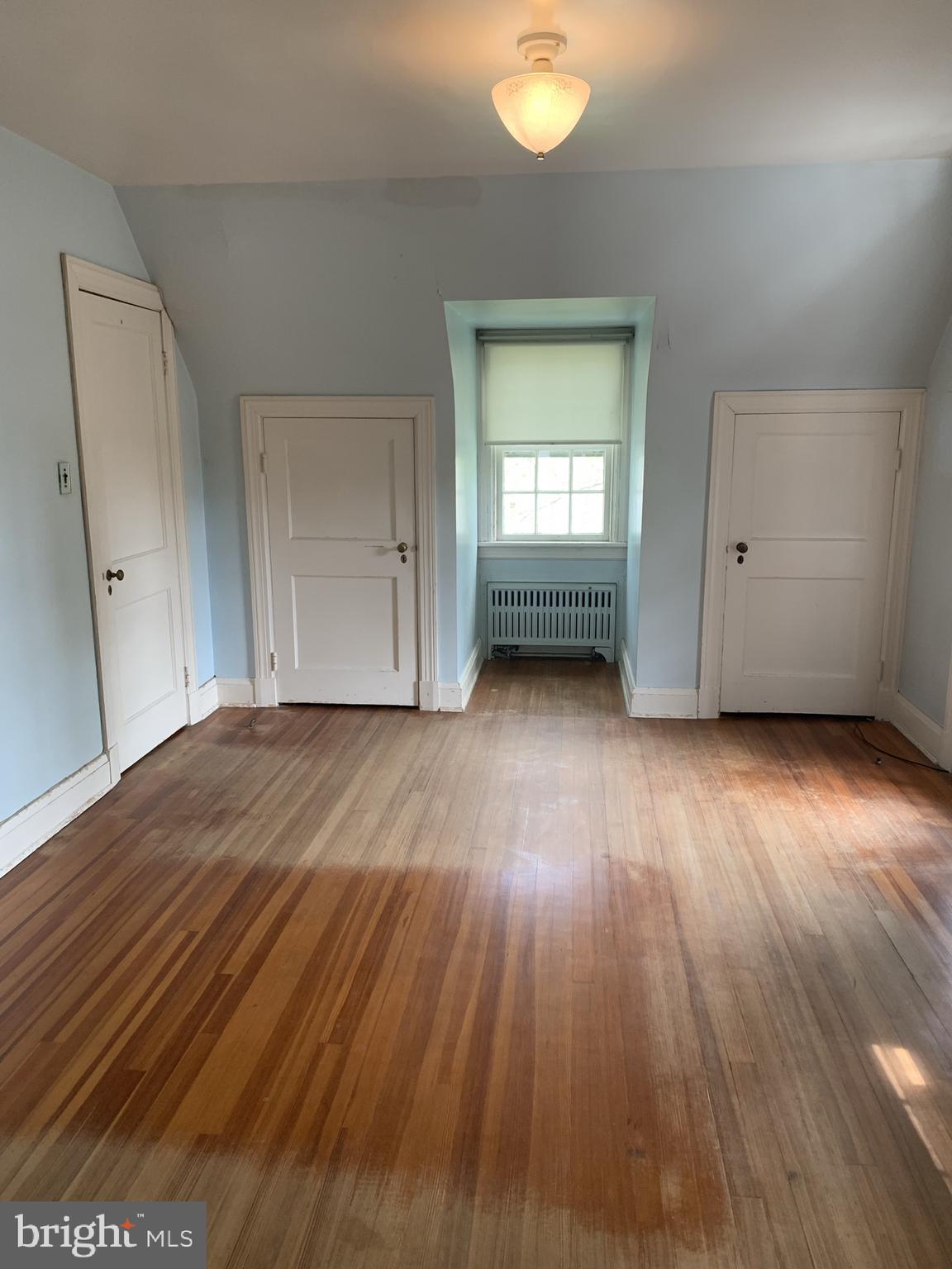 150 Lincoln Road Westminster, MD 21157 - Photo 17 of 39 an empty room with wooden floor and windows