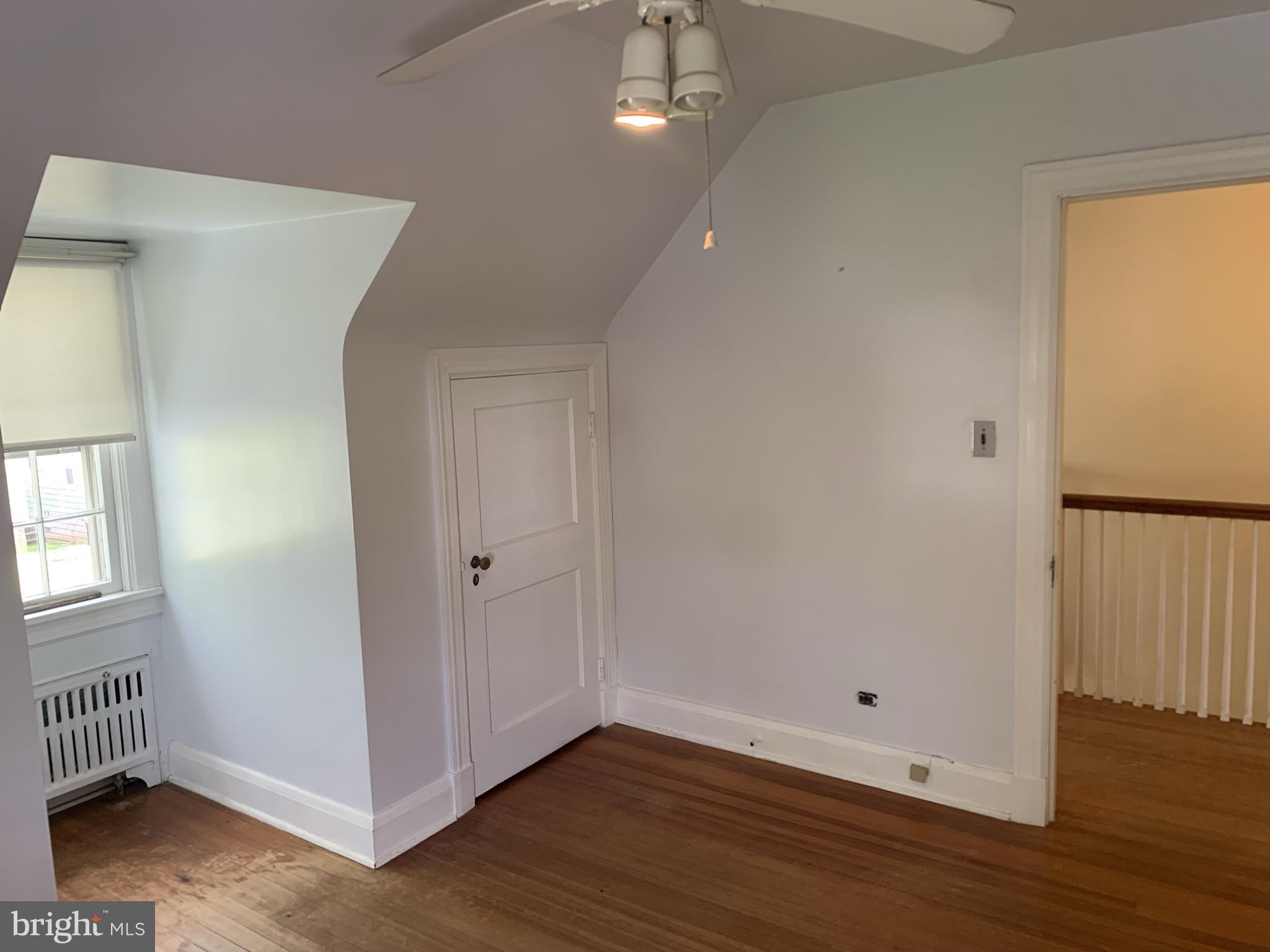 150 Lincoln Road Westminster, MD 21157 - Photo 19 of 39 an empty room with wooden floor and windows