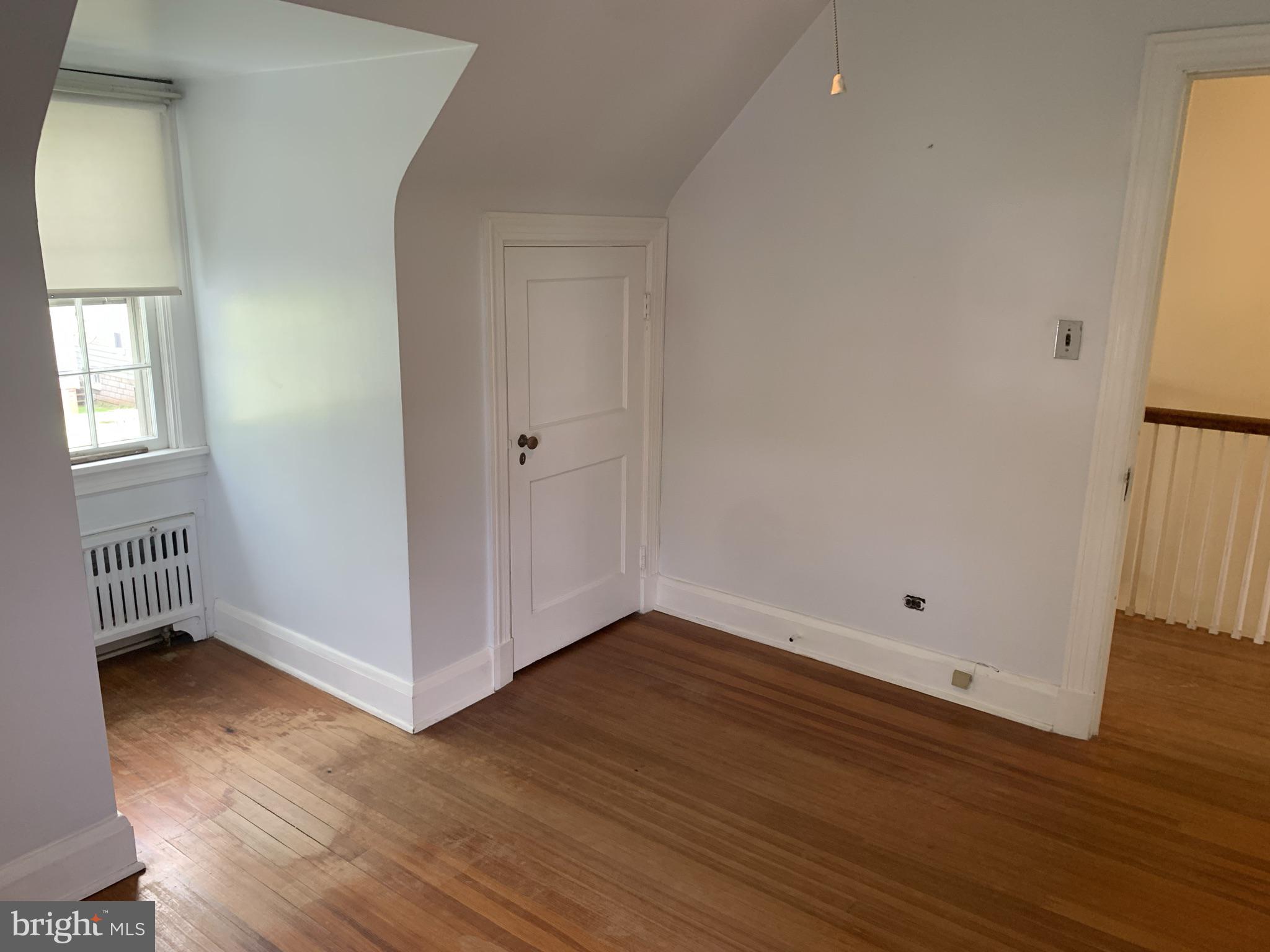 150 Lincoln Road Westminster, MD 21157 - Photo 22 of 39 an empty room with wooden floor and windows