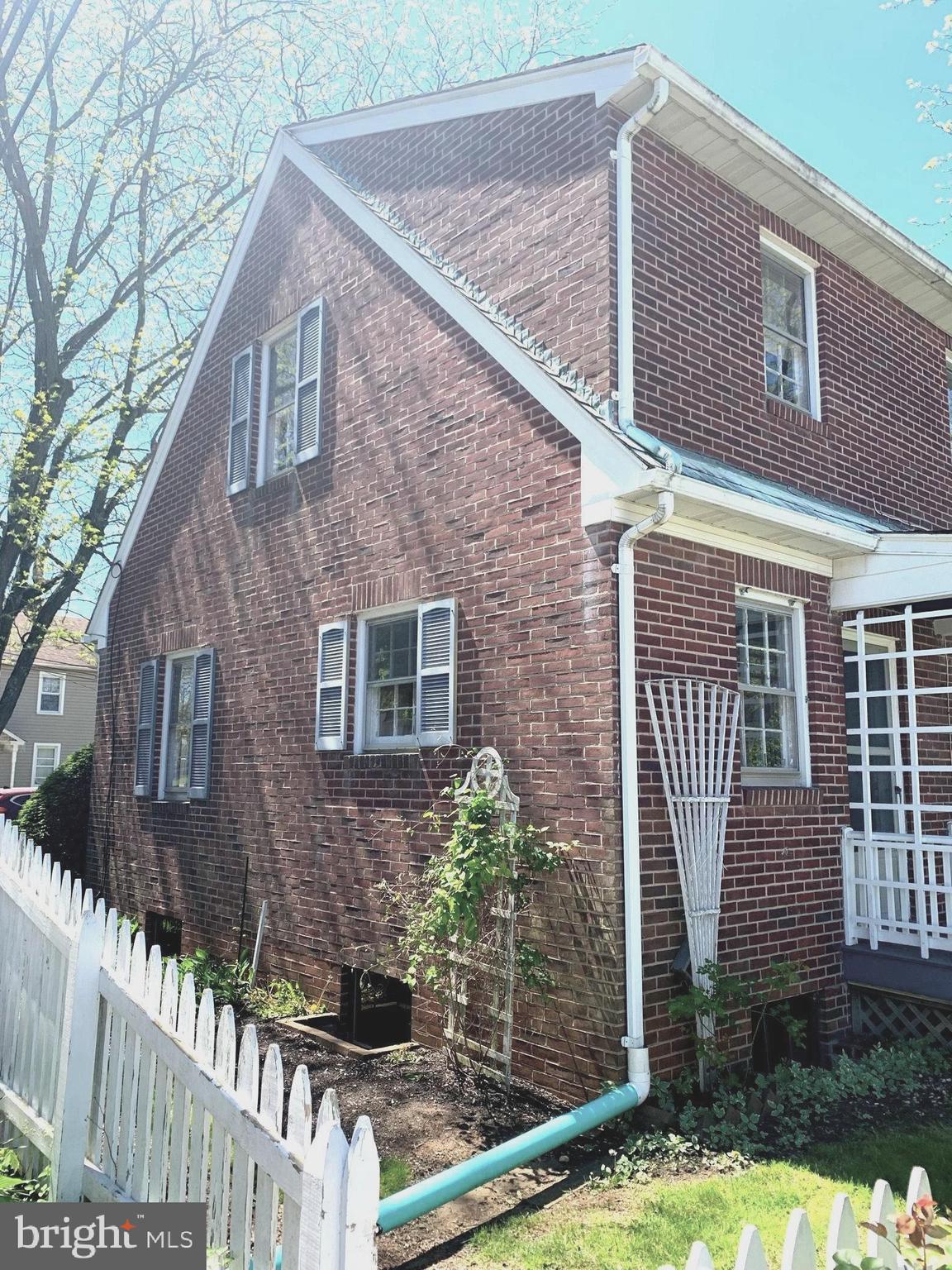 150 Lincoln Road Westminster, MD 21157 - Photo 27 of 39 a brick house with large windows and a yard