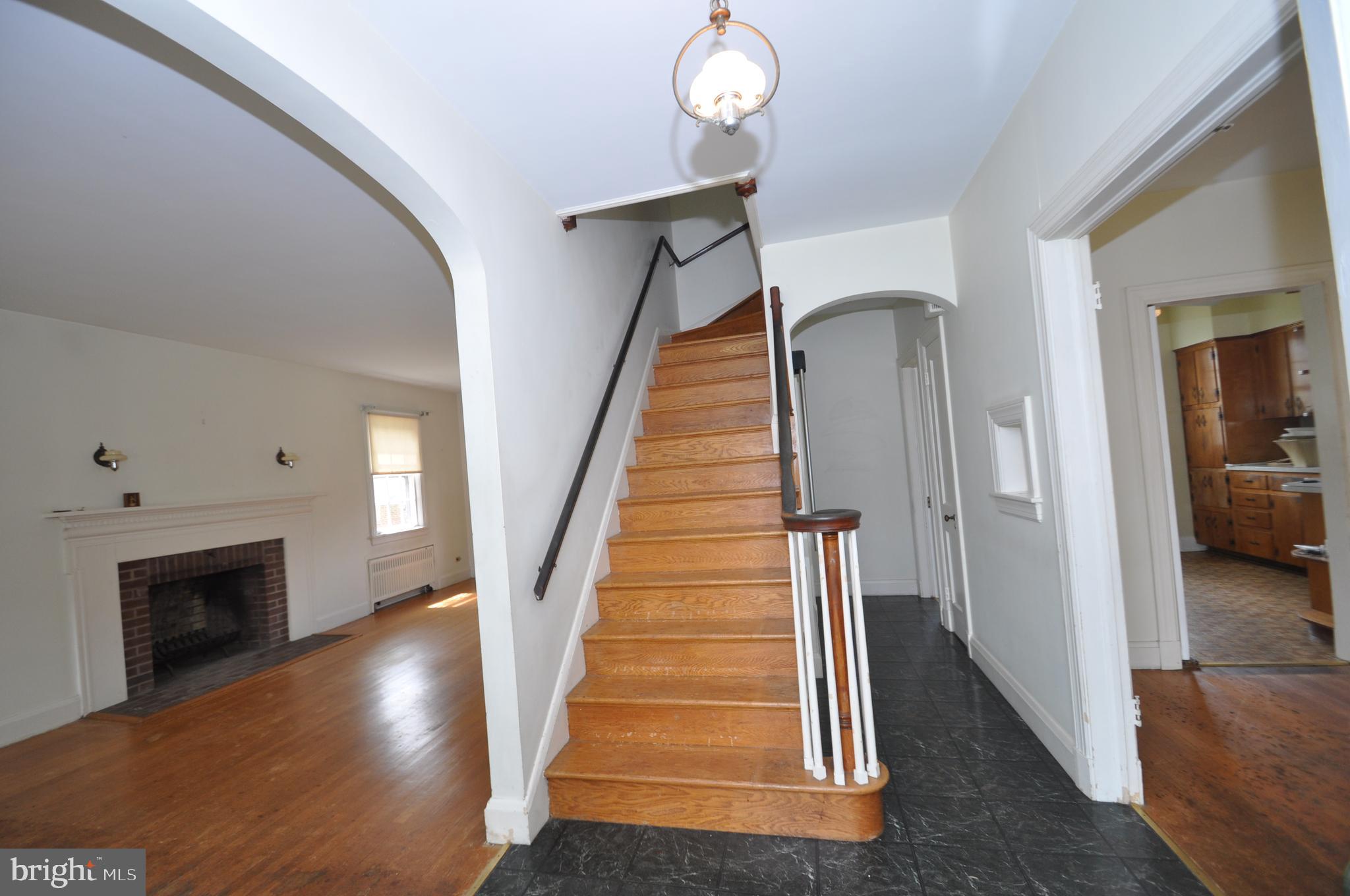 150 Lincoln Road Westminster, MD 21157 - Photo 3 of 39 a view of a hallway with wooden floor and staircase