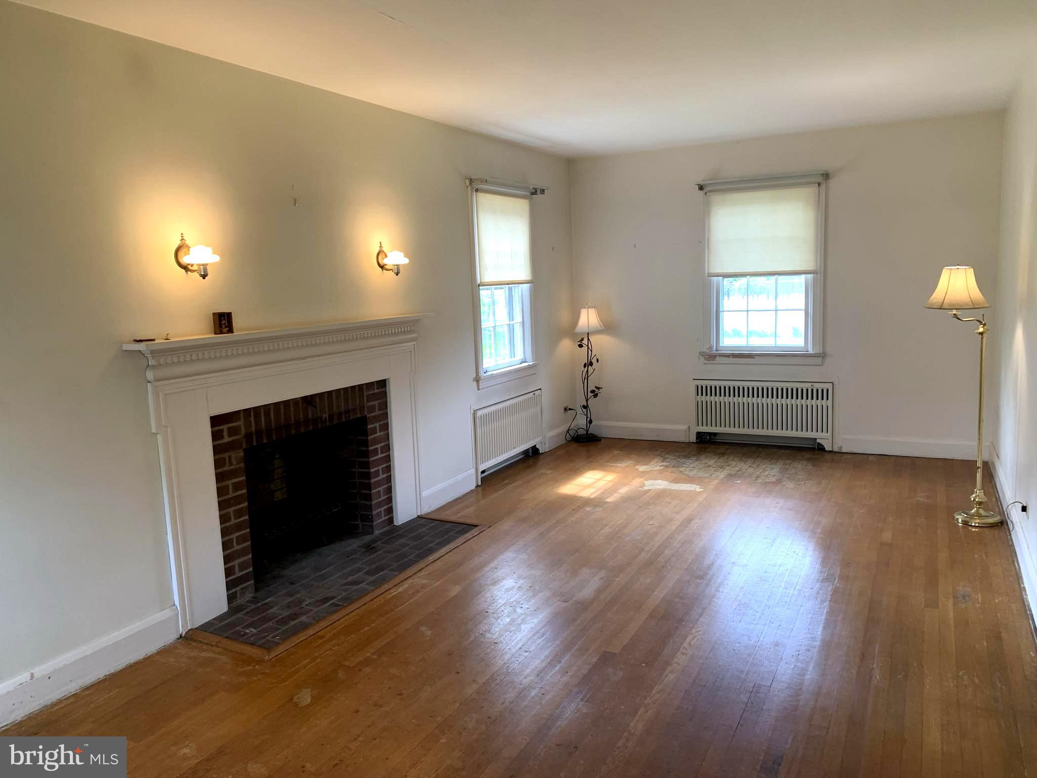 150 Lincoln Road Westminster, MD 21157 - Photo 4 of 39 a view of empty room with wooden floor and fireplace
