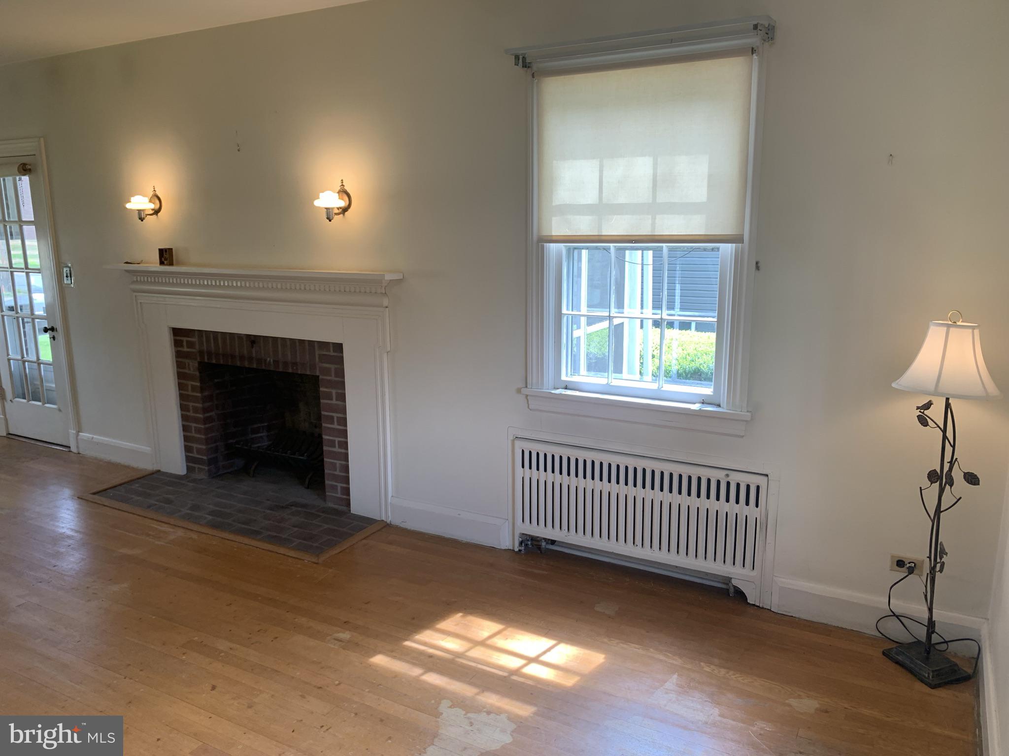 150 Lincoln Road Westminster, MD 21157 - Photo 5 of 39 an empty room with windows and fireplace