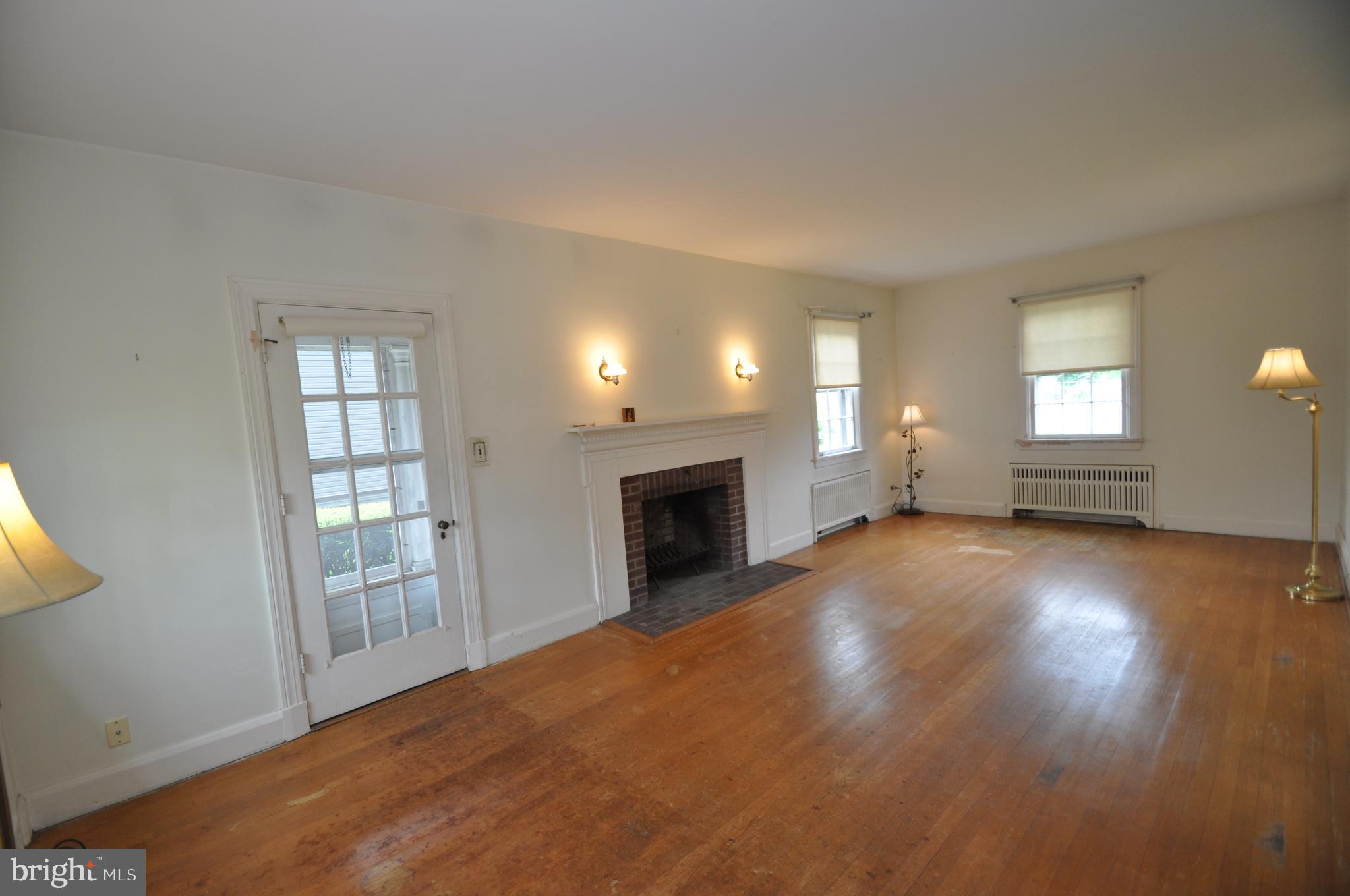 150 Lincoln Road Westminster, MD 21157 - Photo 6 of 39 an empty room with windows and fireplace