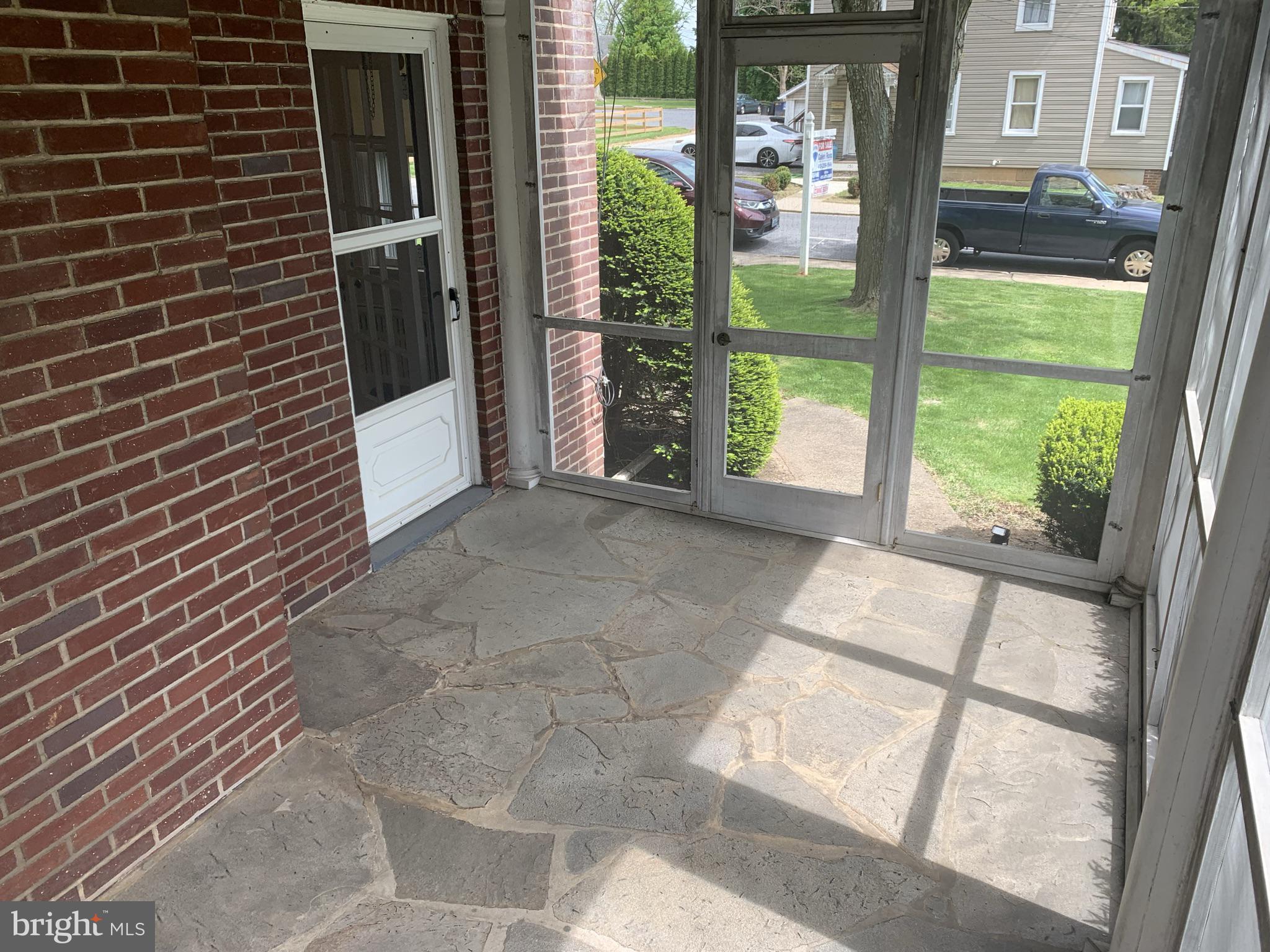 150 Lincoln Road Westminster, MD 21157 - Photo 8 of 39 a view of a porch with a floor to ceiling window next to a yard