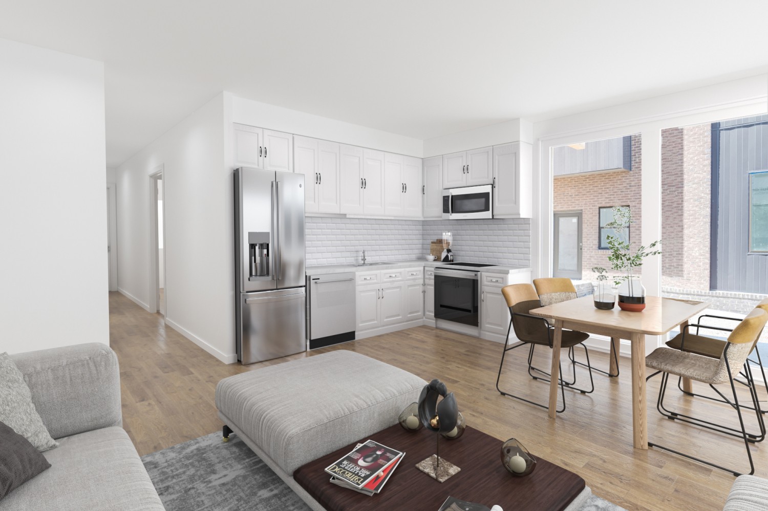 1403 Martin Street Nashville, TN 37203 - Photo 3 of 5 a kitchen with a refrigerator a stove a sink dishwasher and a dining table with wooden floor