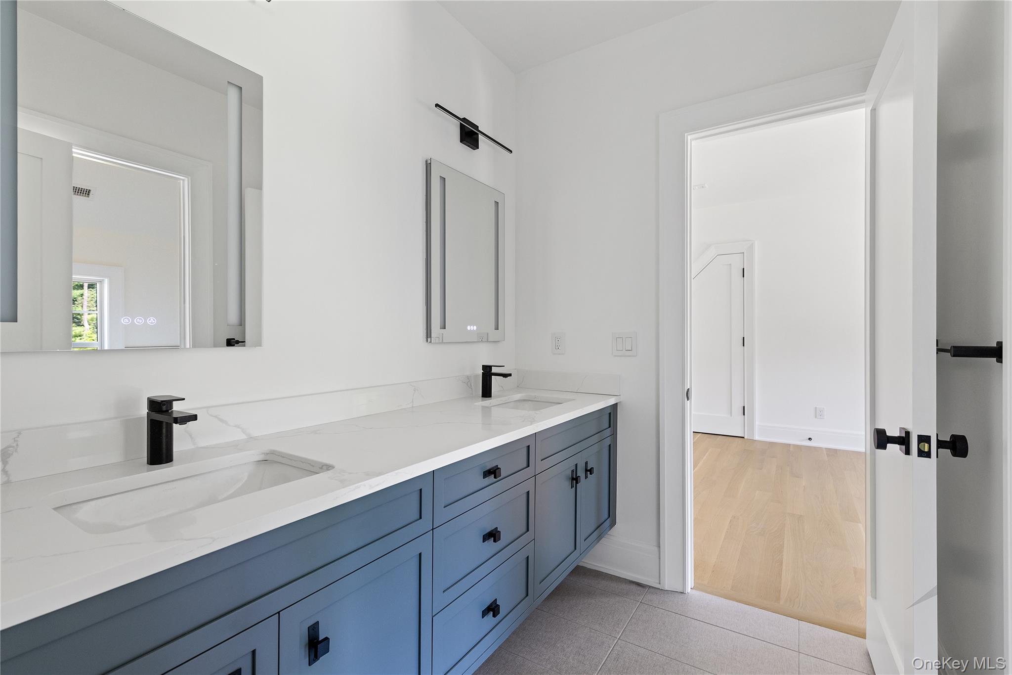 42 Mamaroneck Road Scarsdale, NY 10583 - Photo 38 of 47 Designer details continue throughout the second level, where stylish ensuite baths provide both comfort and convenience for family and guests. This is the second of four ensuite guest baths on this level.