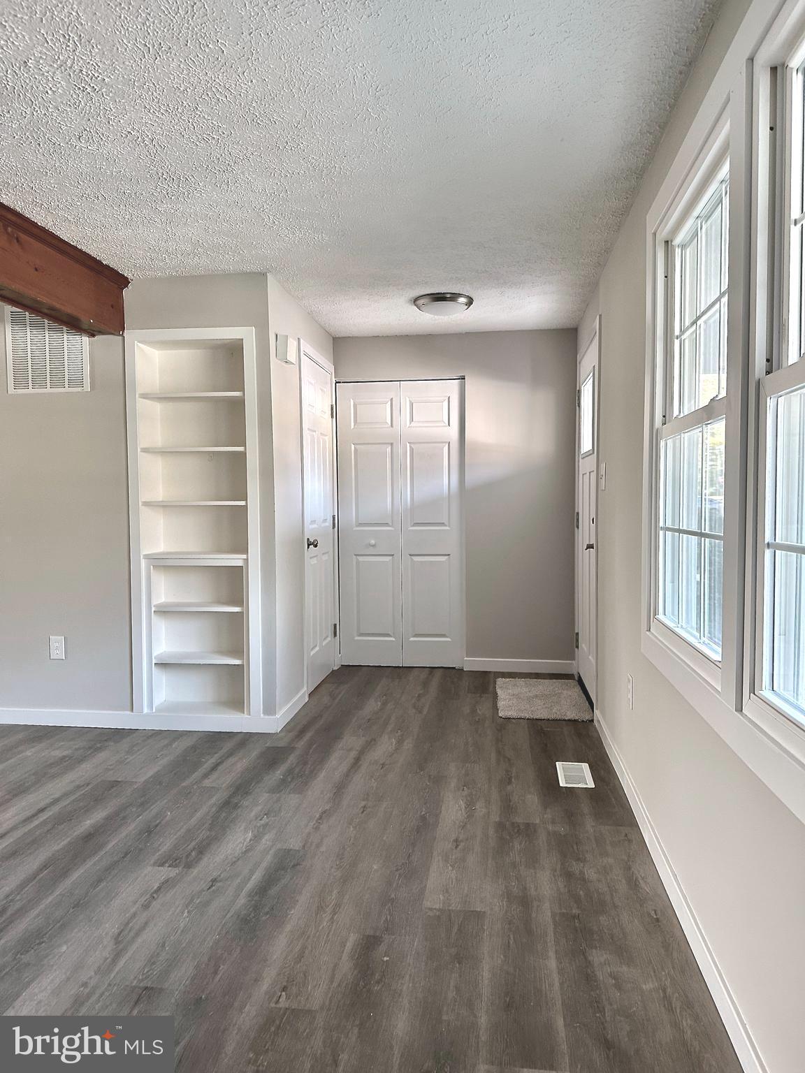 1776 Springfield Lane Frederick, MD 21702 - Photo 11 of 56 wooden floor in an empty room with a window