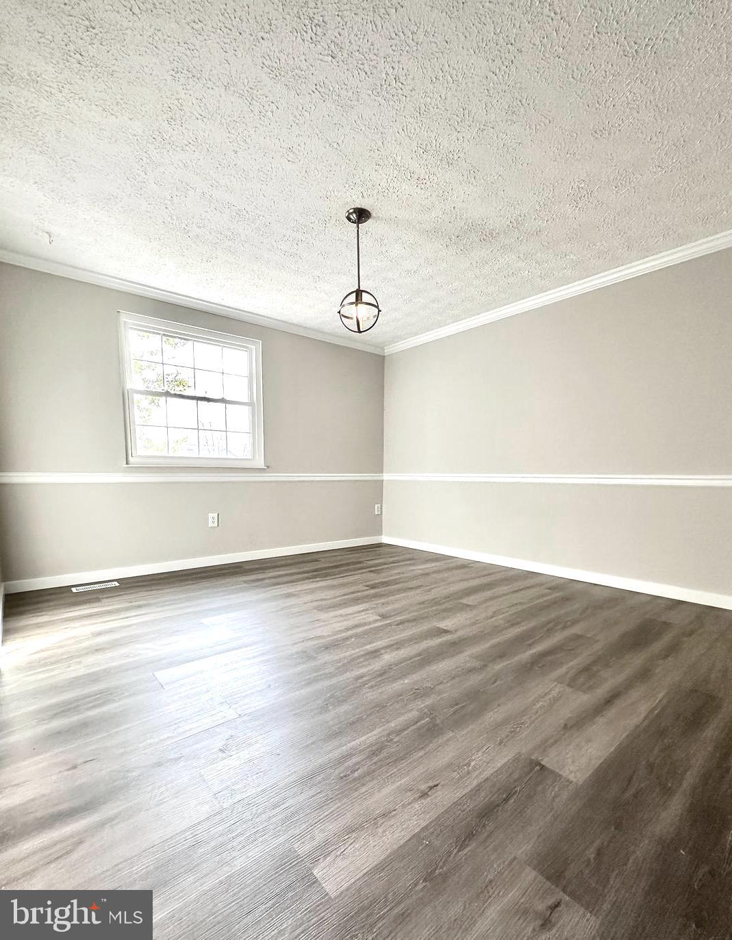 1776 Springfield Lane Frederick, MD 21702 - Photo 22 of 56 an empty room with wooden floor and windows