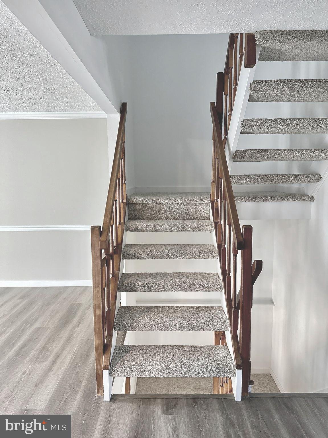 1776 Springfield Lane Frederick, MD 21702 - Photo 23 of 56 a view of staircase with white walls and a window