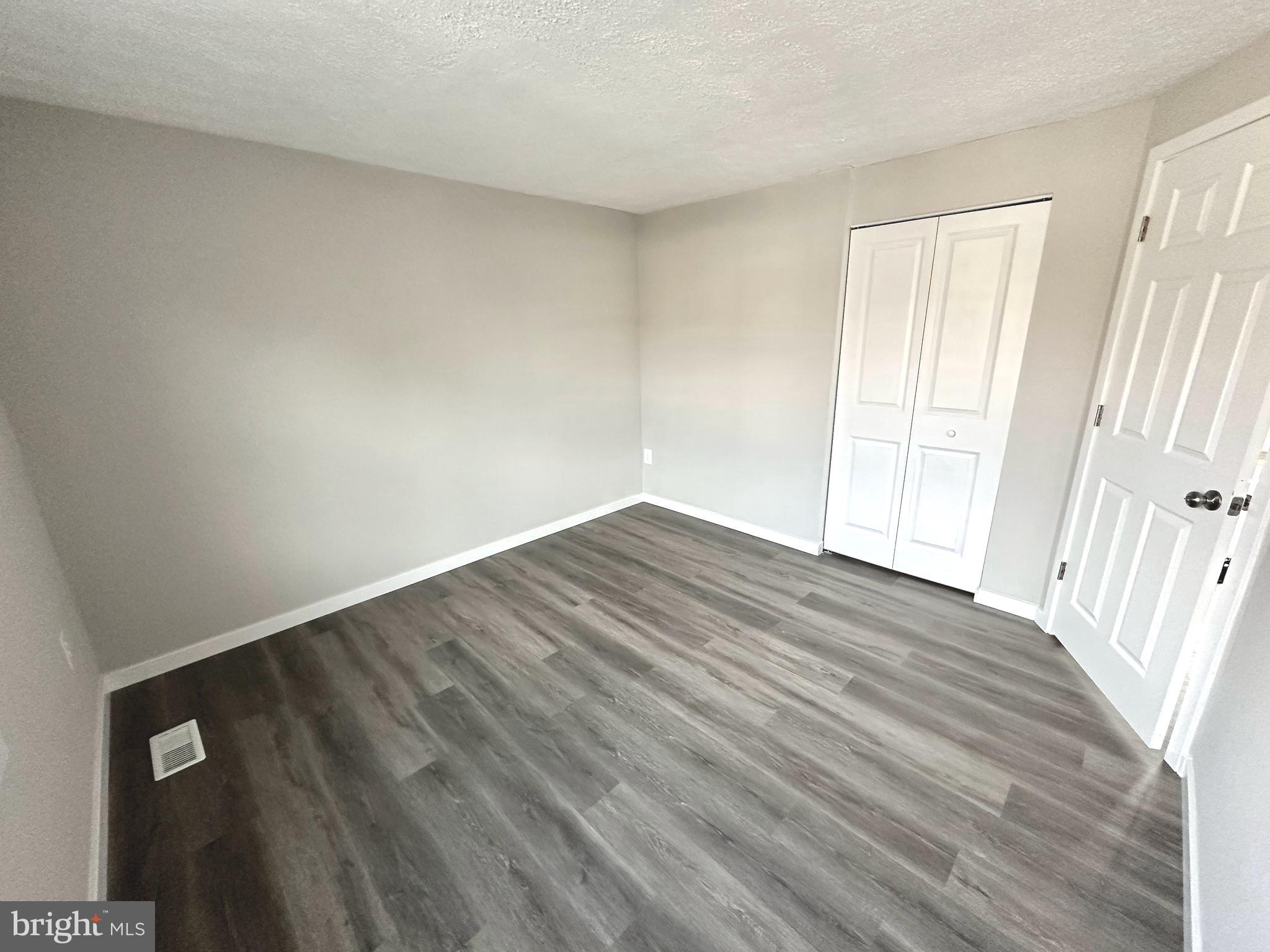 1776 Springfield Lane Frederick, MD 21702 - Photo 28 of 56 a view of empty room with wooden floor