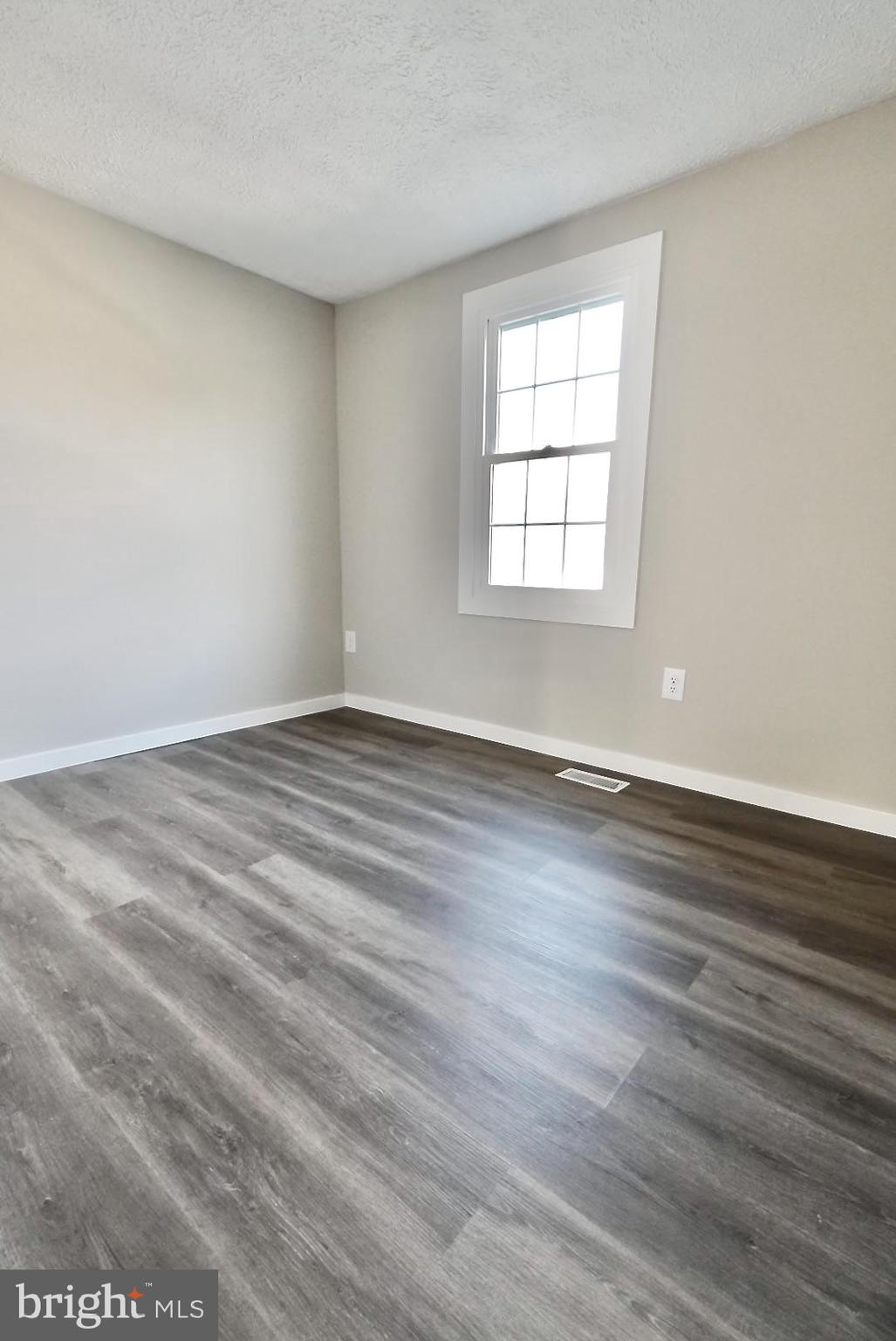 1776 Springfield Lane Frederick, MD 21702 - Photo 29 of 56 wooden floor in an empty room with a window
