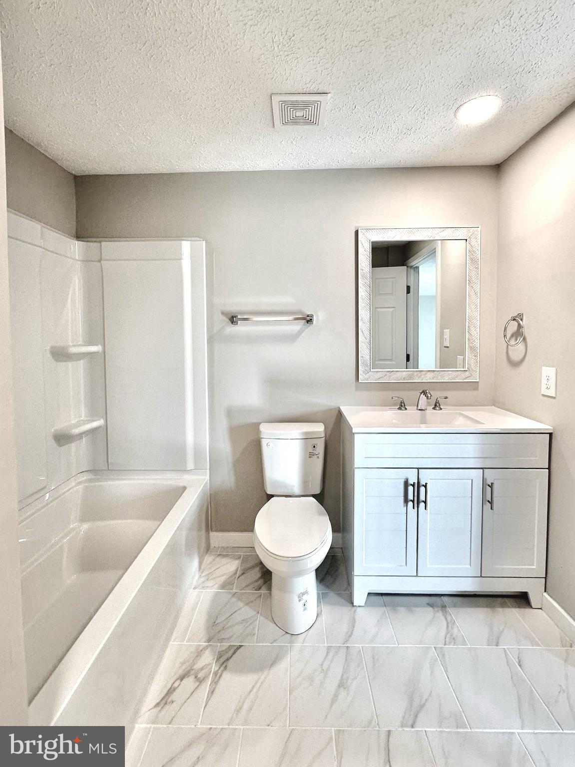 1776 Springfield Lane Frederick, MD 21702 - Photo 32 of 56 a bathroom with a sink toilet and a bathtub