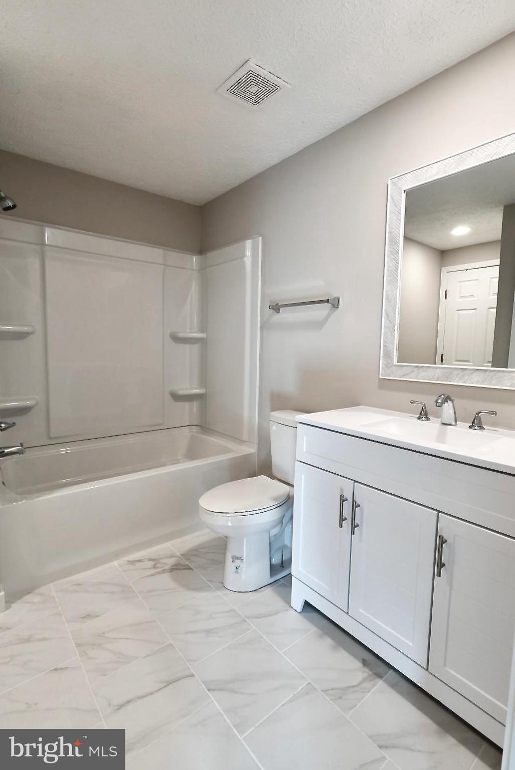 1776 Springfield Lane Frederick, MD 21702 - Photo 33 of 56 a bathroom with a sink a toilet and shower