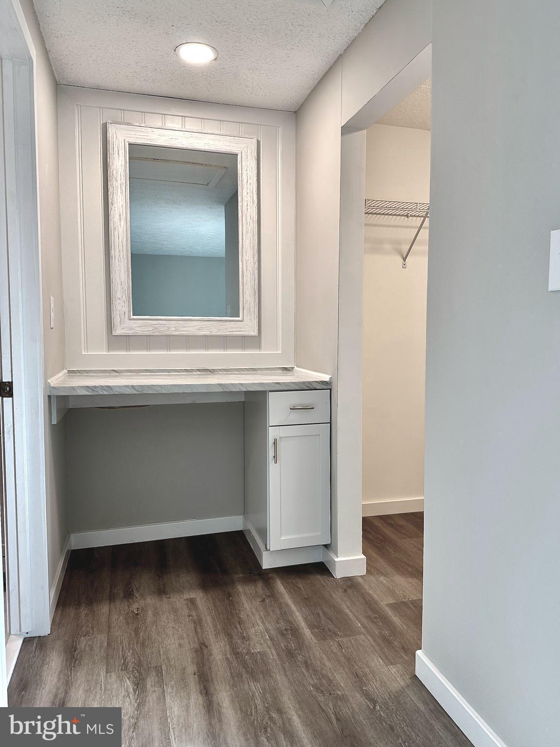 1776 Springfield Lane Frederick, MD 21702 - Photo 42 of 56 a view of an empty room with wooden floor and a window