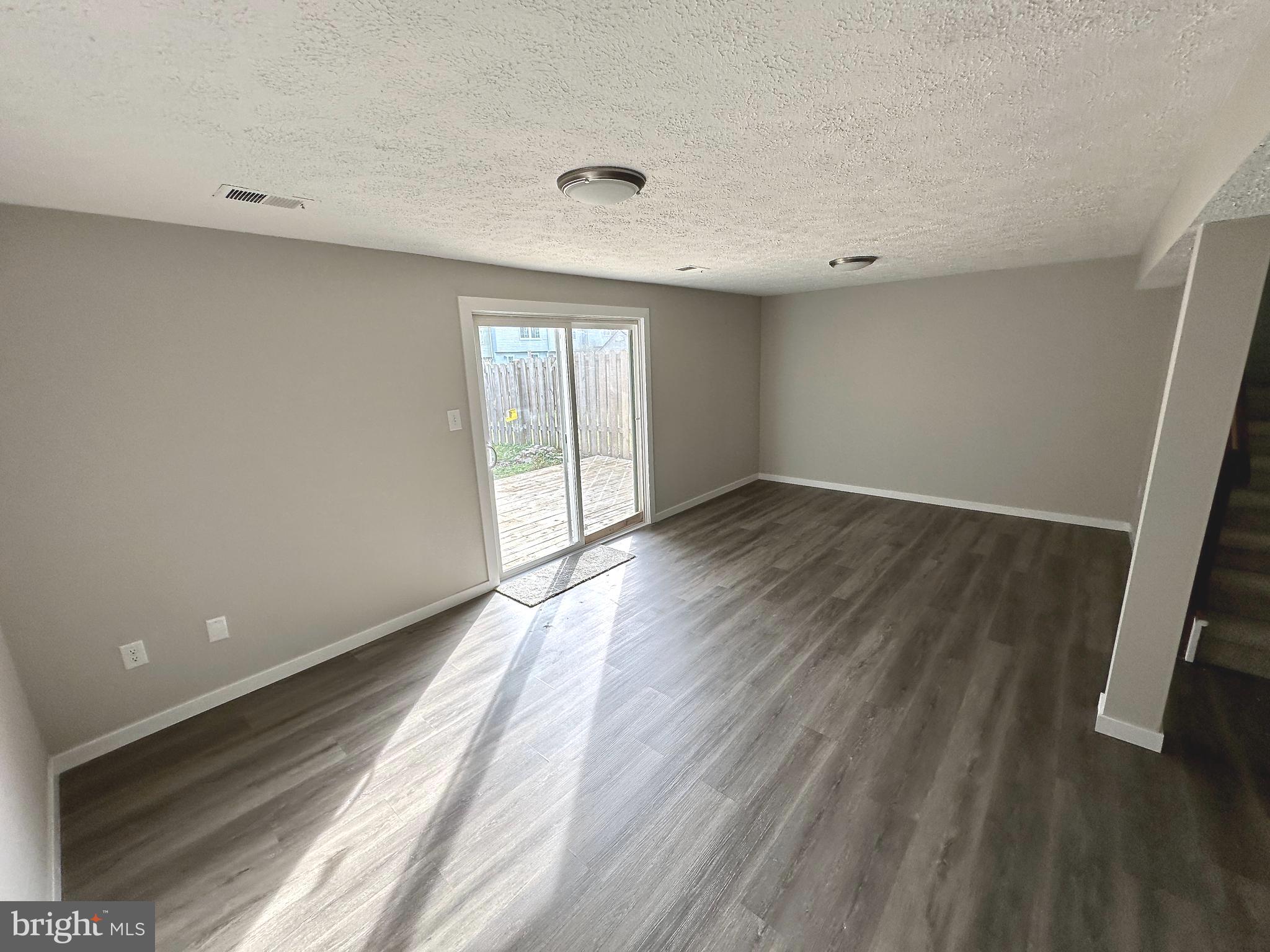 1776 Springfield Lane Frederick, MD 21702 - Photo 45 of 56 wooden floor in an empty room with a window