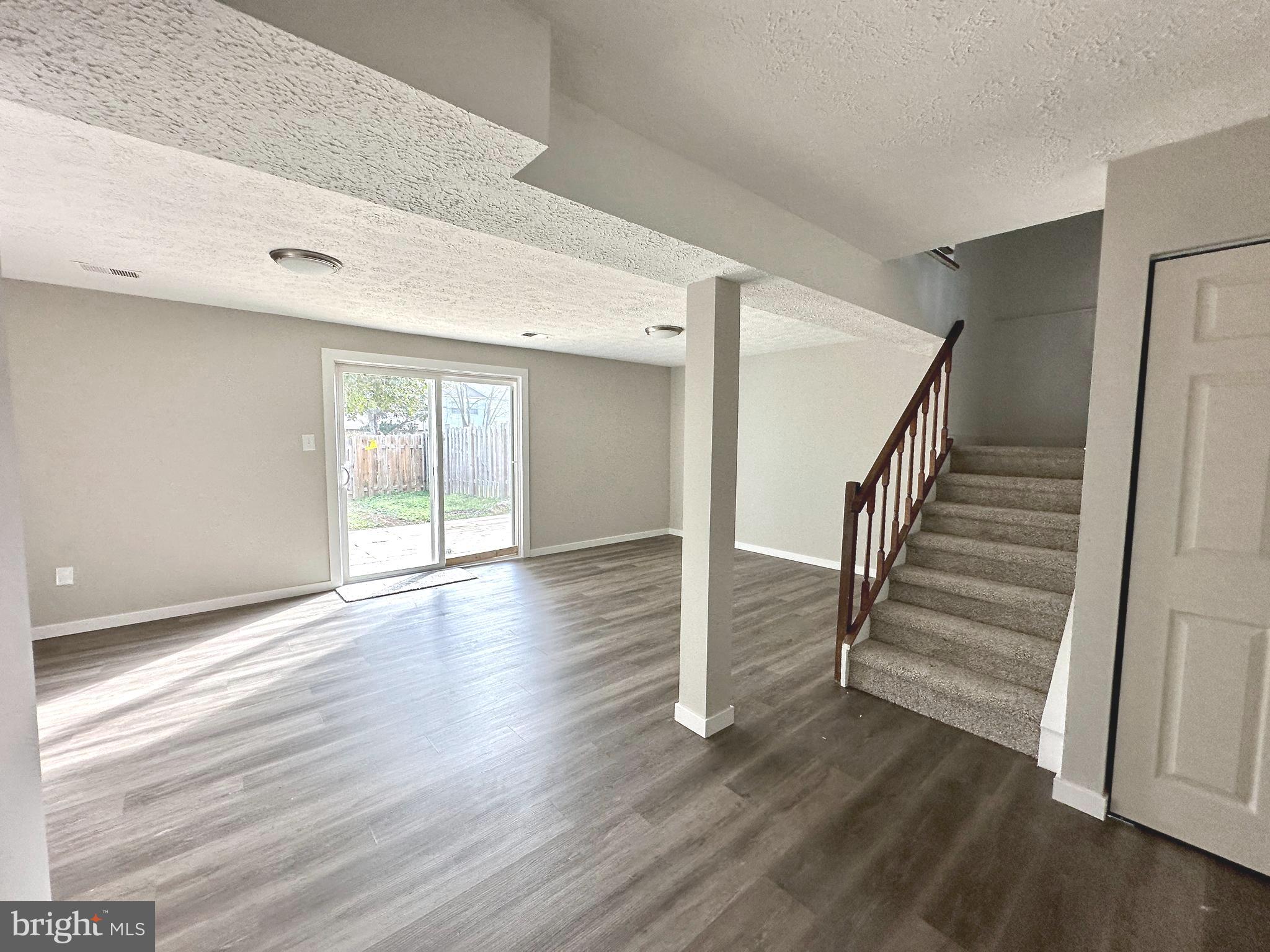 1776 Springfield Lane Frederick, MD 21702 - Photo 46 of 56 a view of a room with wooden floor and white walls