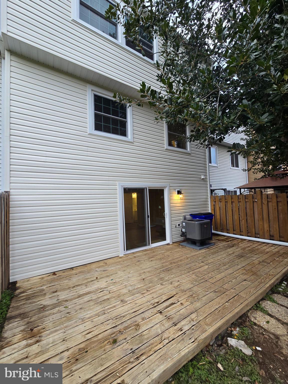1776 Springfield Lane Frederick, MD 21702 - Photo 50 of 56 a view of a house with wooden deck and a trees