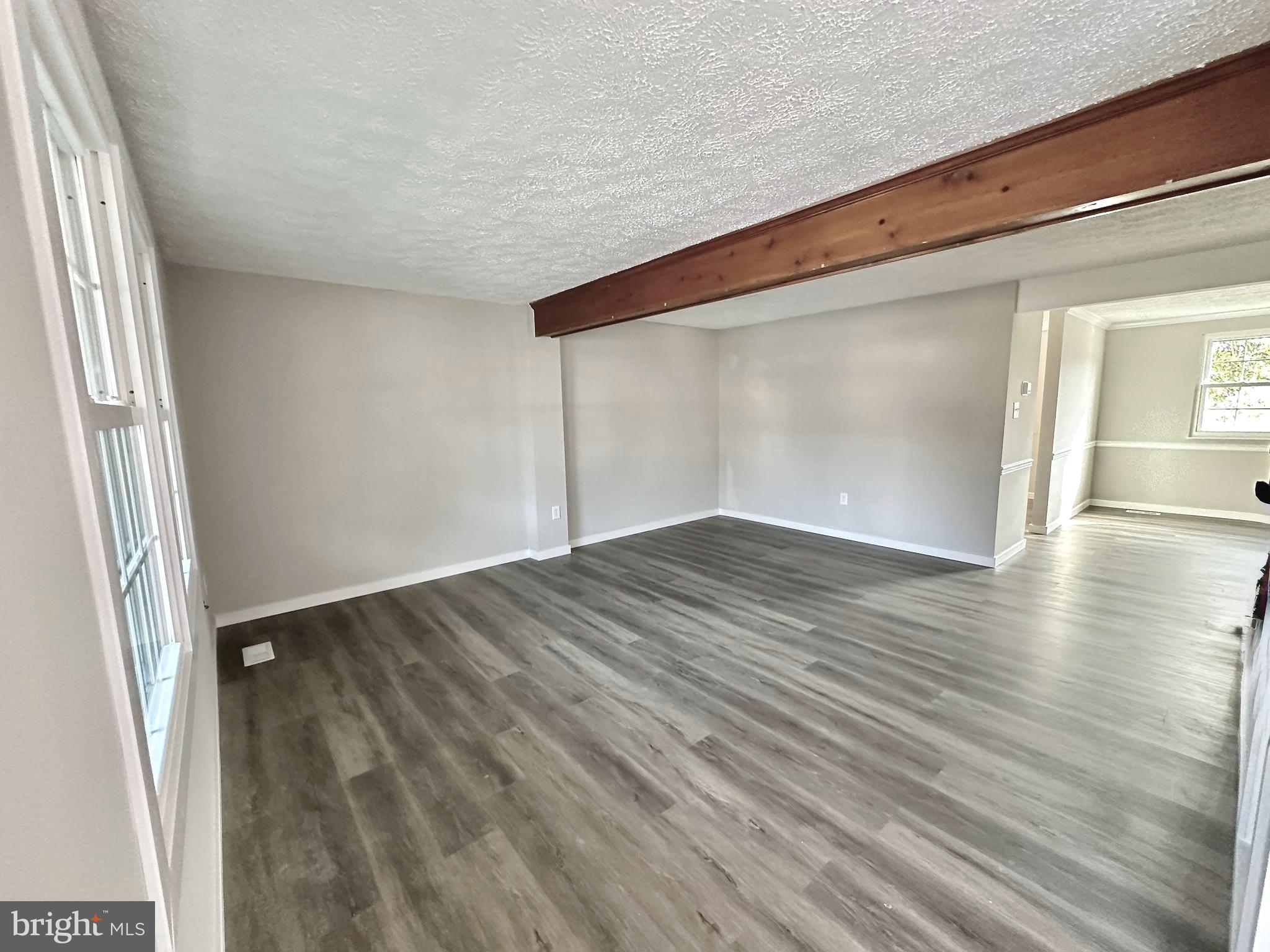 1776 Springfield Lane Frederick, MD 21702 - Photo 8 of 56 an empty room with wooden floor and windows