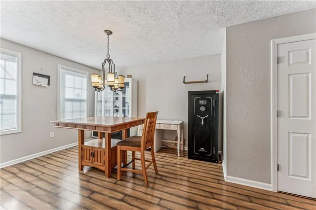 a dining room with furniture and window
