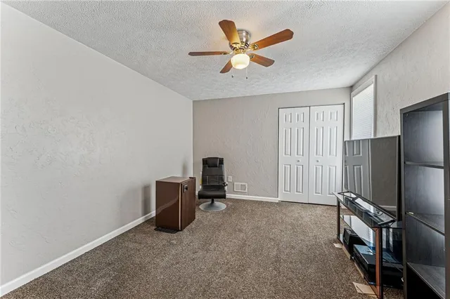 a view of a livingroom with a workspace