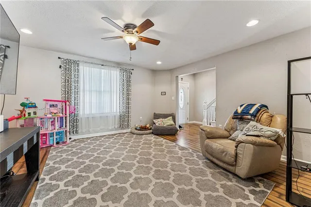 a living room with furniture and a window