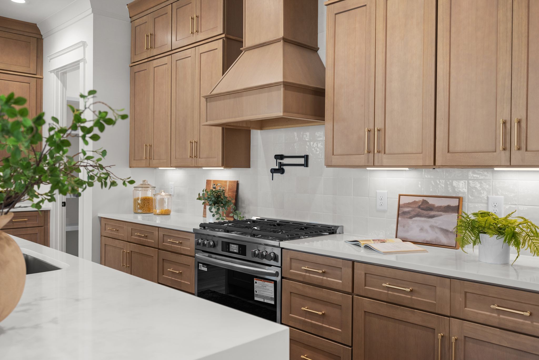 6103 Henry Ford Drive Nashville, TN 37209 - Photo 11 of 40 a kitchen with stainless steel appliances a white stove top oven and cabinets