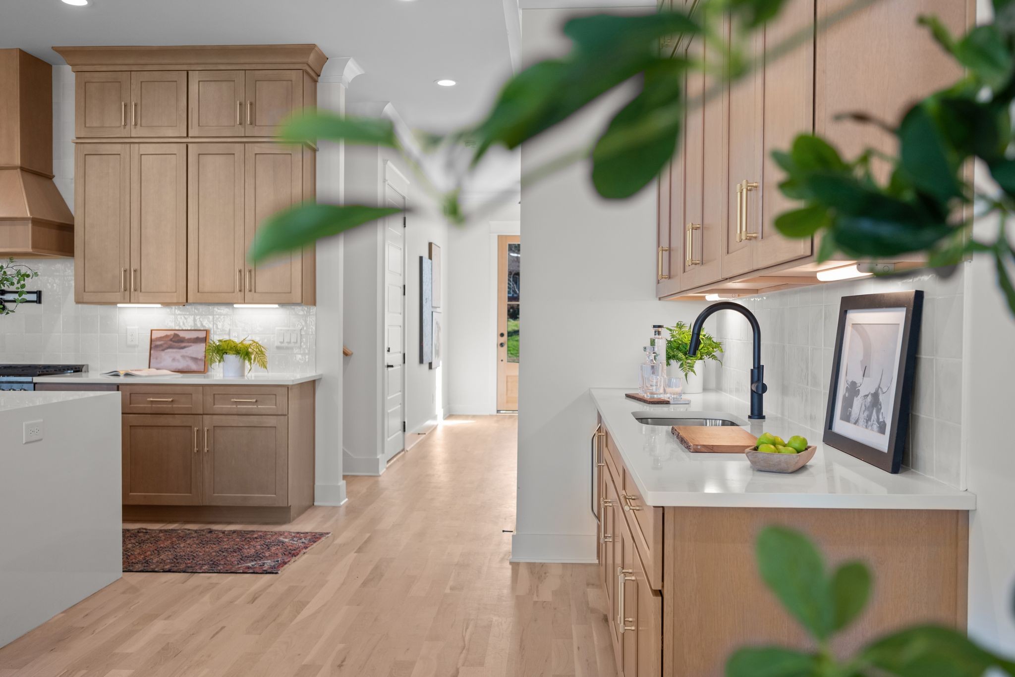 6103 Henry Ford Drive Nashville, TN 37209 - Photo 15 of 40 a kitchen with stainless steel appliances kitchen island granite countertop a refrigerator a stove a sink and white cabinets with wooden floor