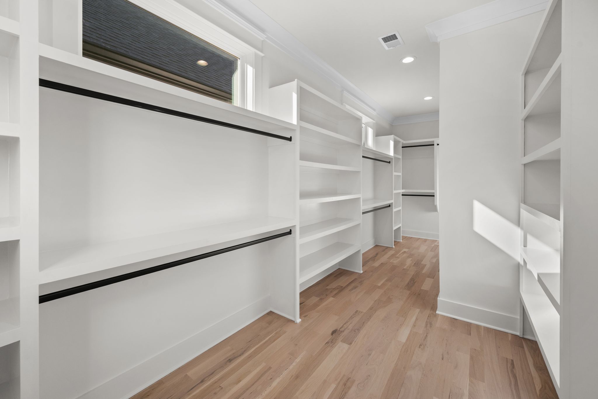6103 Henry Ford Drive Nashville, TN 37209 - Photo 29 of 40 a view of a walk in closet and wooden floor