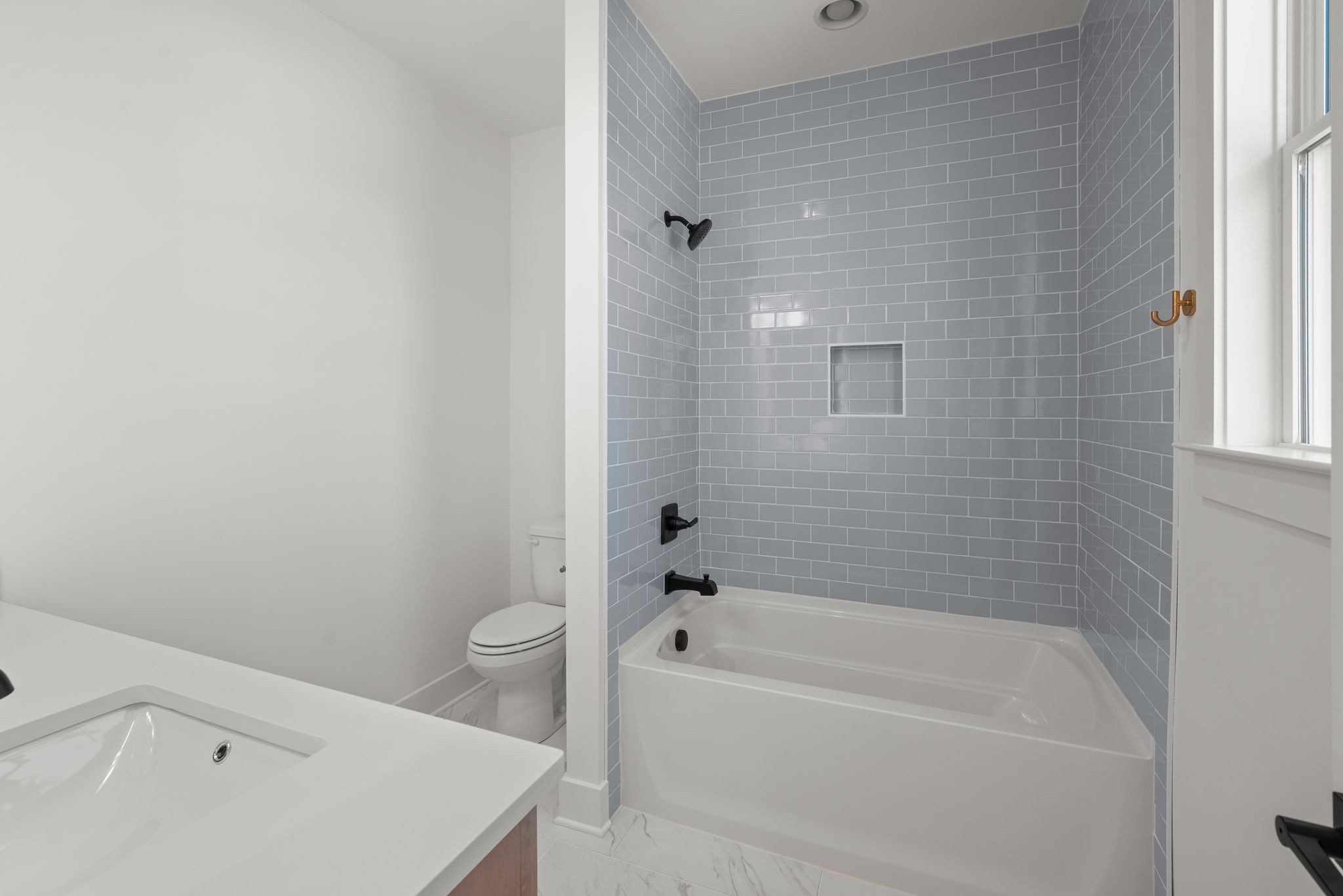 6103 Henry Ford Drive Nashville, TN 37209 - Photo 37 of 40 a white bath tub sitting next to a white toilet