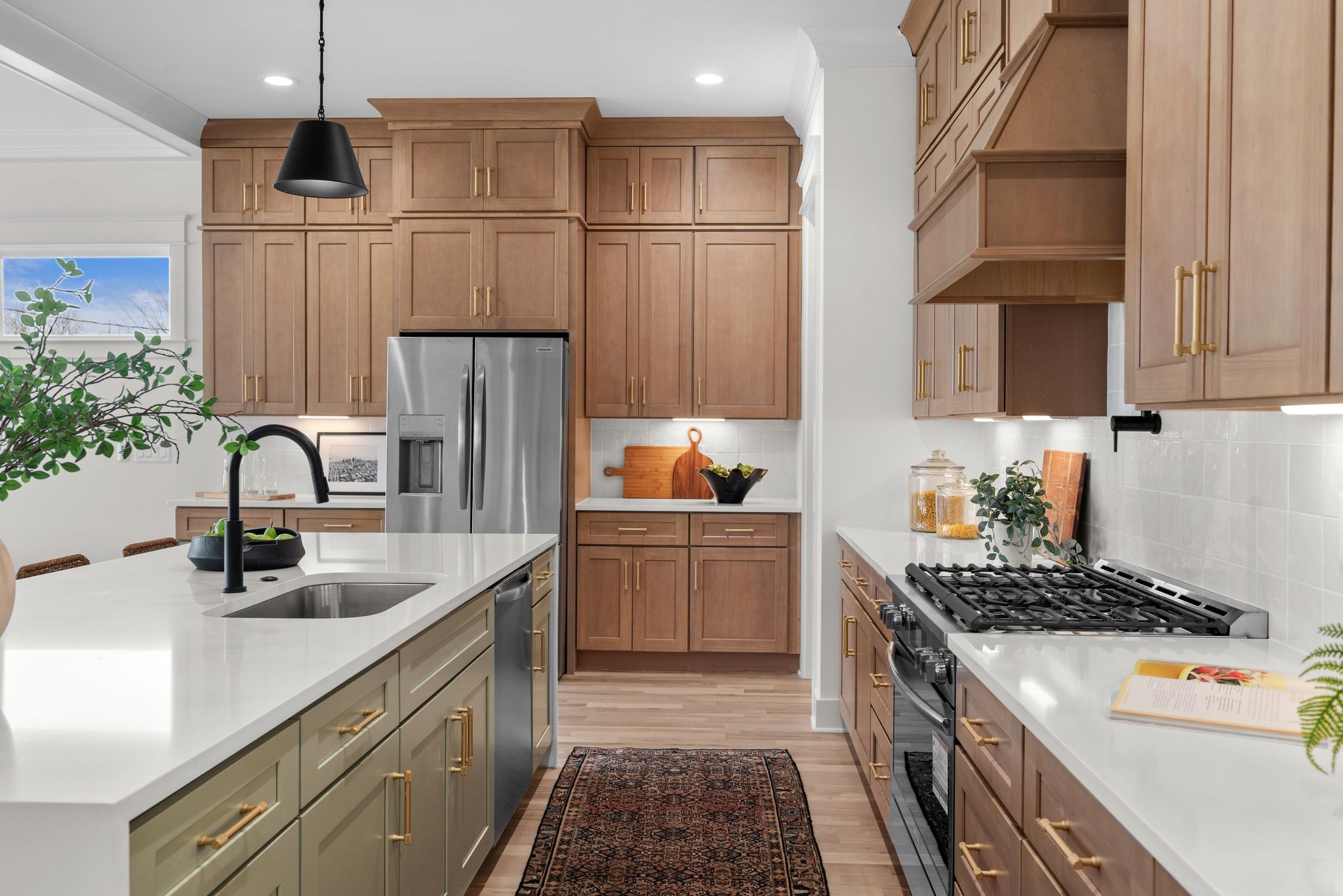6103 Henry Ford Drive Nashville, TN 37209 - Photo 9 of 40 a kitchen with kitchen island granite countertop a sink stainless steel appliances and cabinets
