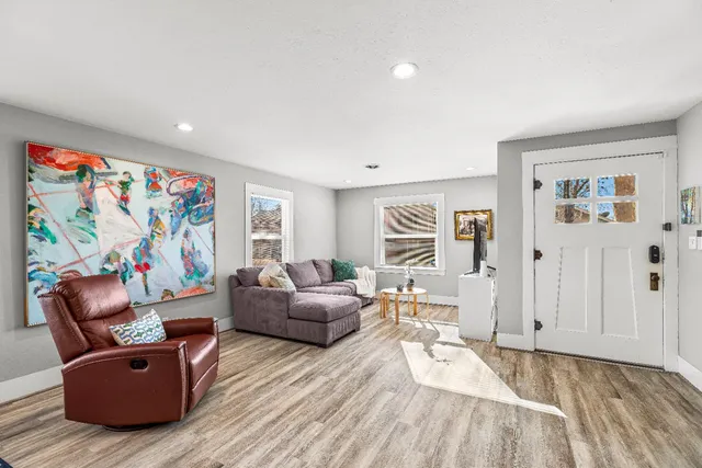 a living room with furniture and a window
