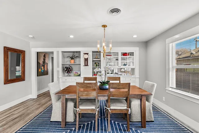a kitchen with a refrigerator sink and cabinets